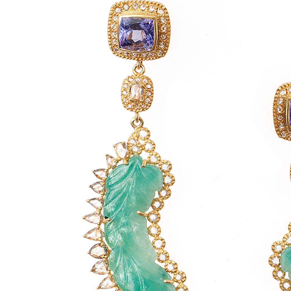 Affinity Earrings Set in 20 Karat Yellow Gold with 17.88 Carat Carved Emerald, 5.90 Carat Tanzanite, and 2.62 Carat Diamonds. There are 17.88 Carats of Emeralds Carved In The Shape Of A Leaf With Diamond Accents All Set in 20K Yellow Gold.