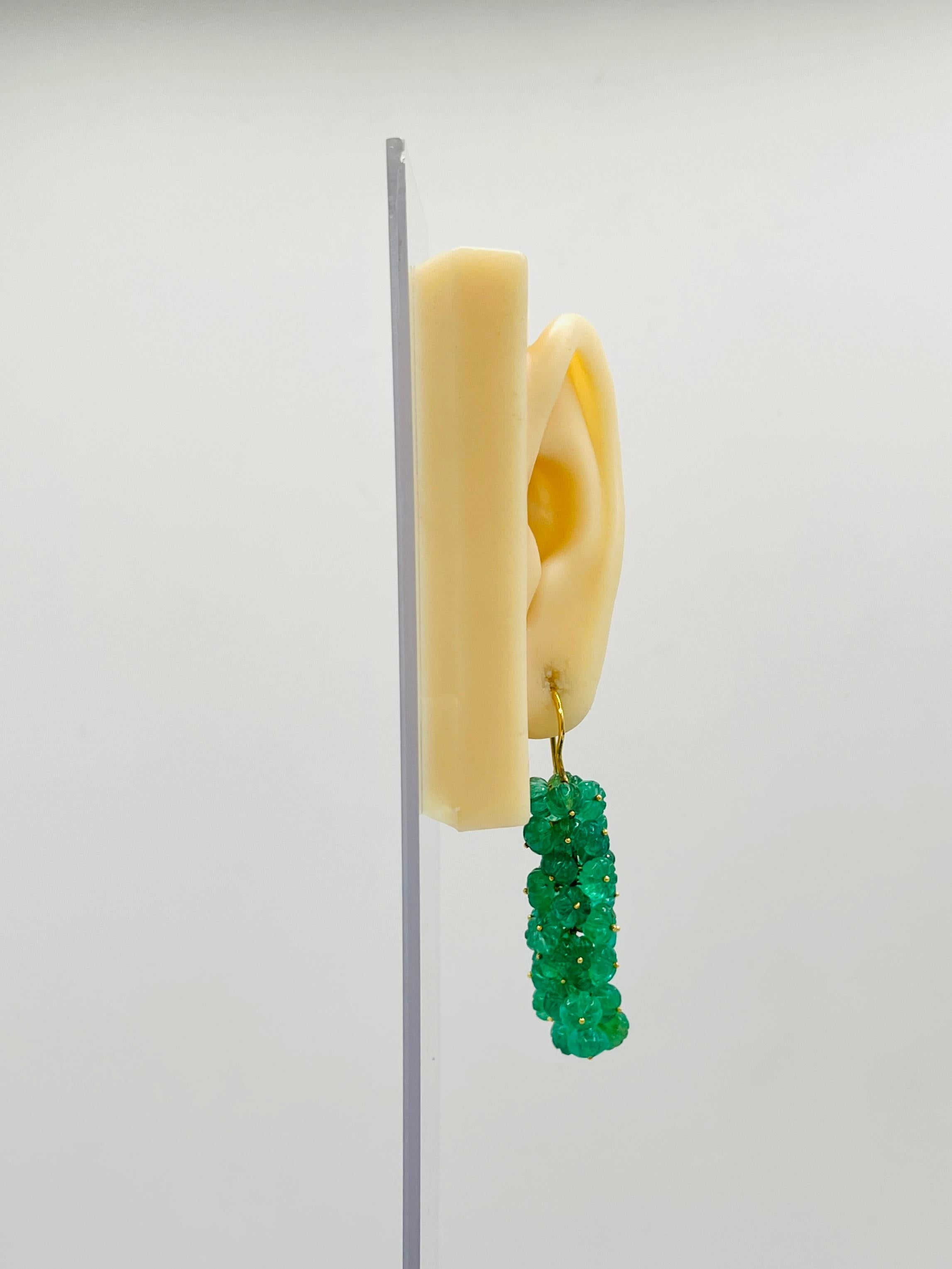 Beautiful 100.00 ct. carved emeralds.  Handmade in 18k yellow gold.  