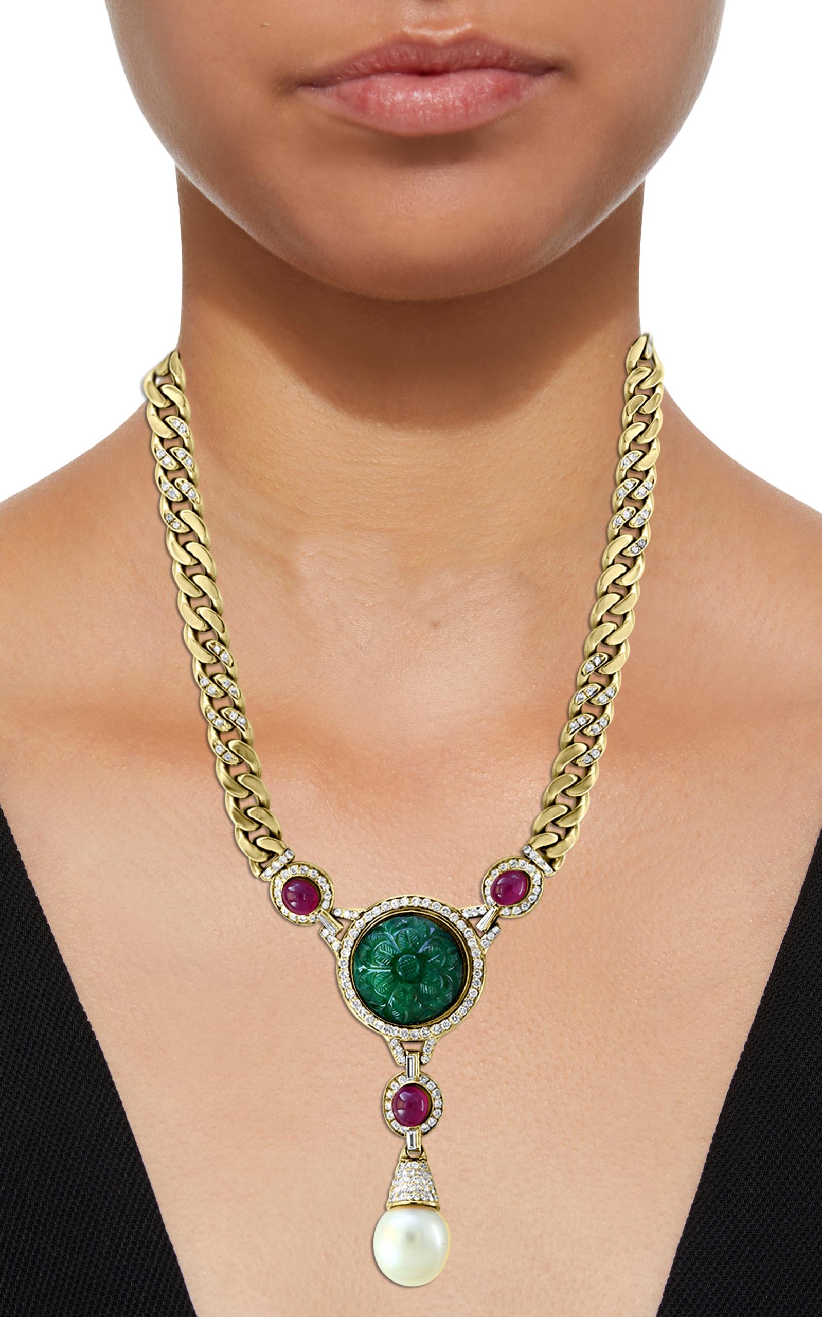 Carved    Emerald and diamond  necklace, consisting of one large  Carved Emerald approximately  20 Carat surrounded by   round brilliant cut diamonds . This Magnificent Necklace has three natural rubies approximately 5 Carats and one large drop of