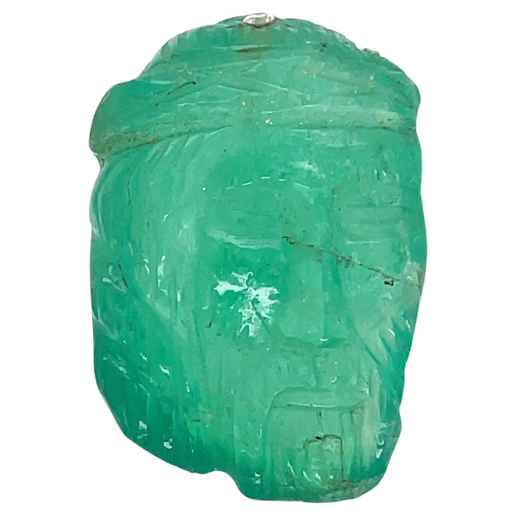 This exquisitely carved emerald, weighing a remarkable 60.84 carats, beautifully captures the image of Jesus Christ.

Originating from the verdant landscapes of Colombia, South America.

It is a holy gemstone that stands for salvation, hope, and