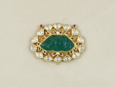 Carved Emerald Maharaja Mughal pendant with diamond polki and rubies in 22K gold