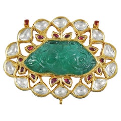 Carved Emerald Maharaja Mughal pendant with diamond polki and rubies in 22K gold