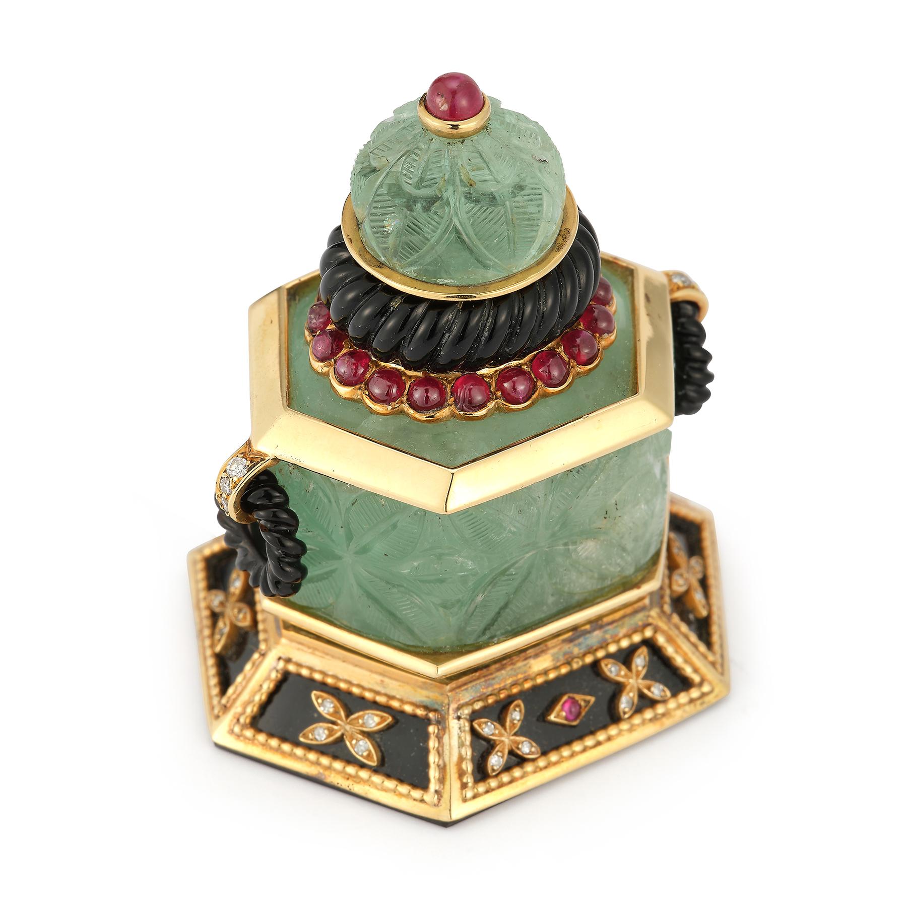 Carved Emerald Perfume Bottle or flask or snuff bottle by Mappin and Webb

Consisting of carved emeralds, onyx, cabochon rubies, &  round cut diamonds. 

Measurements: 2