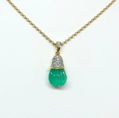 Carved Emerald with Diamond Pendant Set in 18 Karat Gold Settings