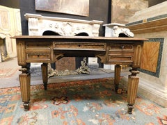 Carved empire desk, in walnut with opening side shelves, Italy