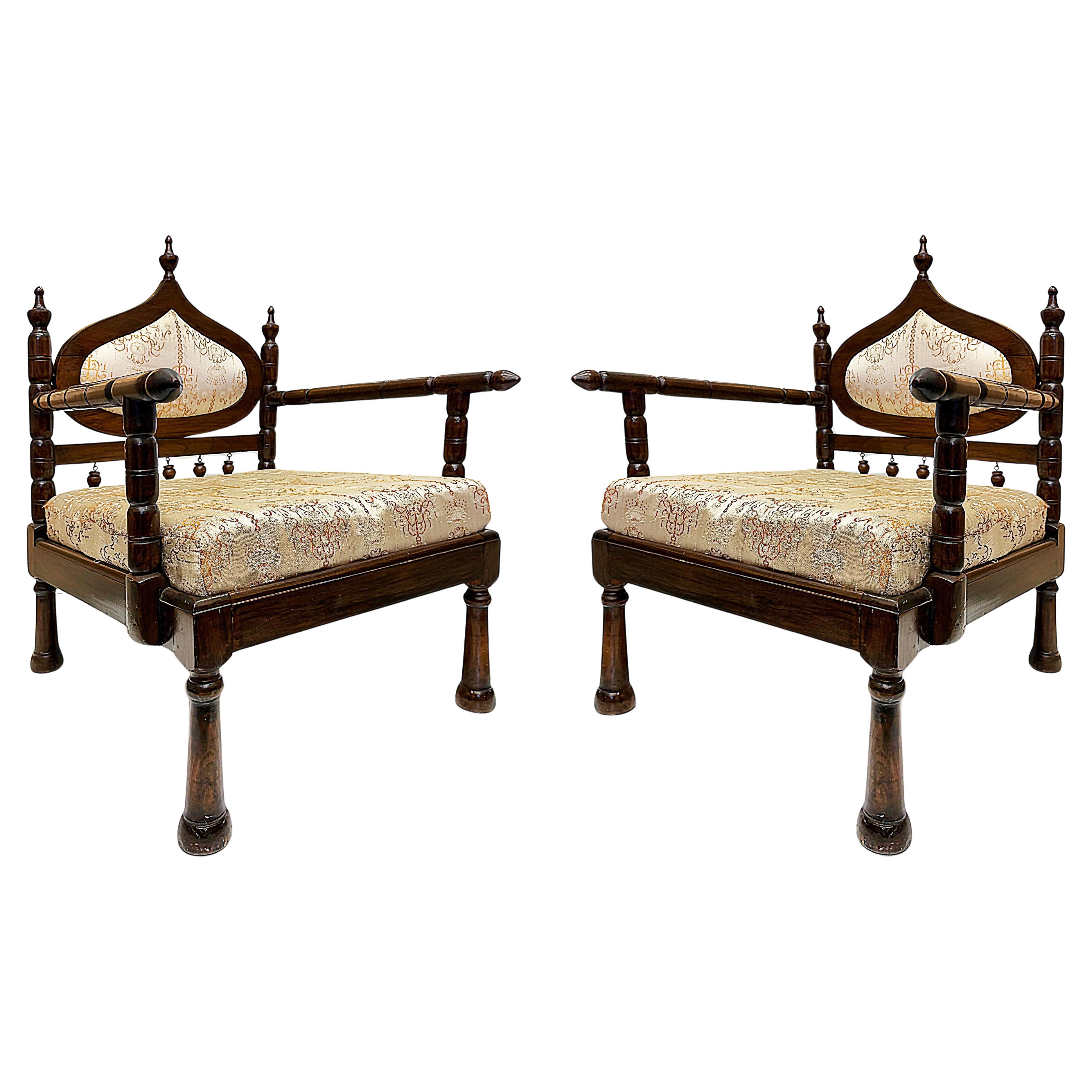 Carved End of Indo-British Colonial Period Lounge Chairs, Pair For Sale