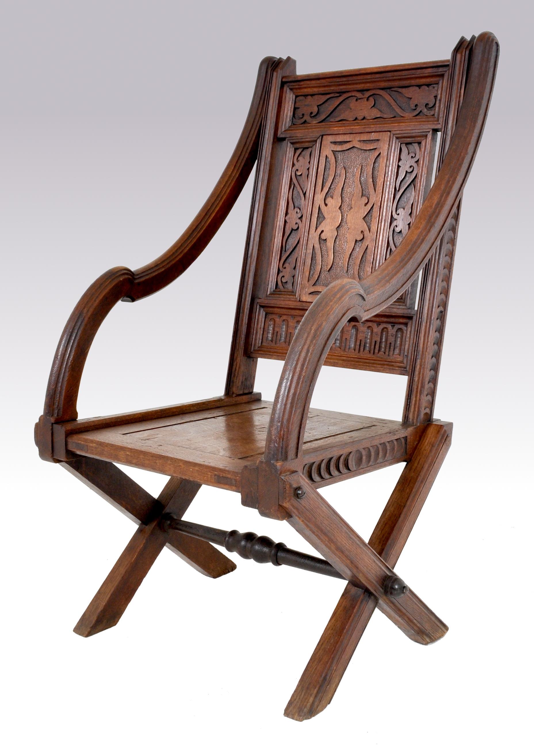Antique carved English Gothic Revival Bishop's throne chair, A. W. Pugin, circa 1855. The chair having a 'blind' geometric fretwork back with shaped arms and 
