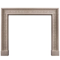 Carved English Stone Fireplace with Scrolled Detailing