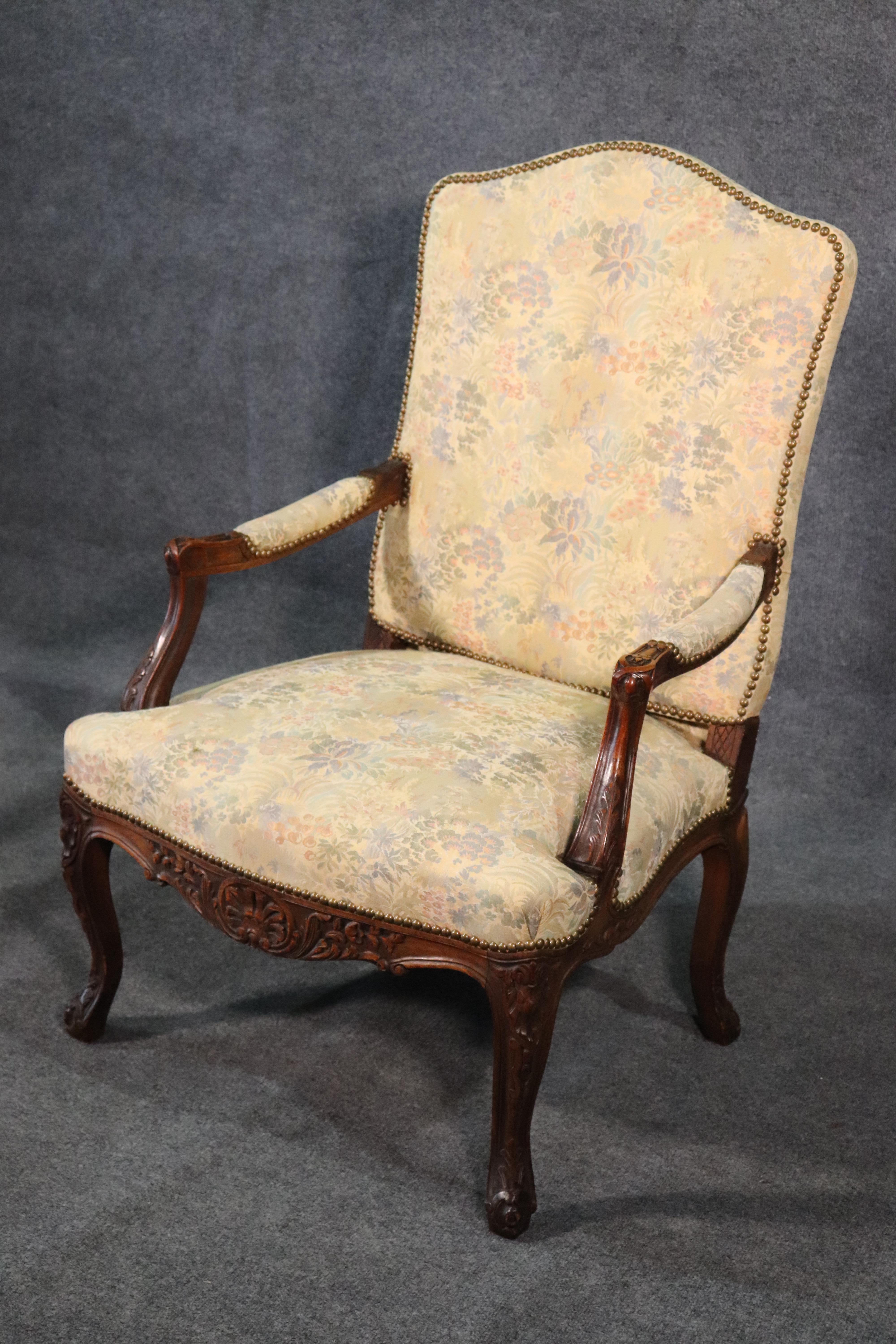 This is a Fine quality English 1930s era armchair designed in the Georgian manner. The chair is in very good condition and has fine machine tapestry upholstery and nailhead trim. The chair measures
42 tall x 28 wide x 27 deep seat height 18 tall.