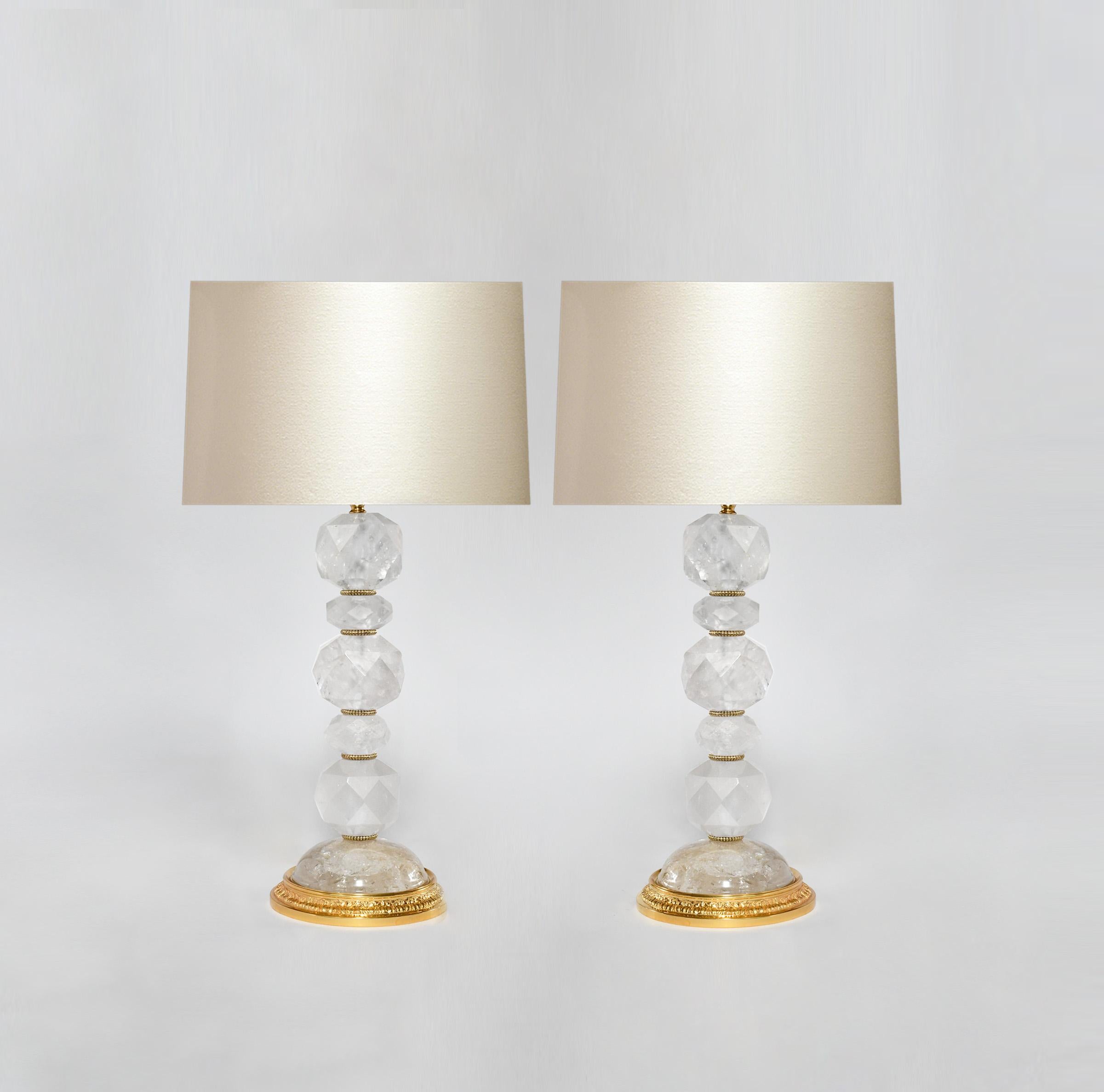 Pair of facet globe rock crystal lamps with fine cast brass bases. Created by Phoenix Gallery, NYC.
To the top of the rock crystal is 15 in.
(Lampshade not included).
Custom size and metal finish upon request.
  
