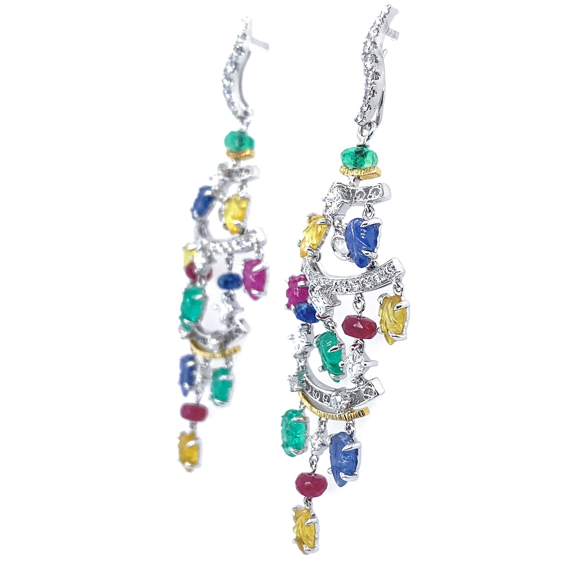 This pair of playfully elegant earrings is designed by the renowned Hong Kong jewelry designer, Ms. Dilys Young. Dilys’ artfully mixes 4.48 carats of carved fancy colored sapphires, 1.42 carats of ruby beads, along with a carefully selected