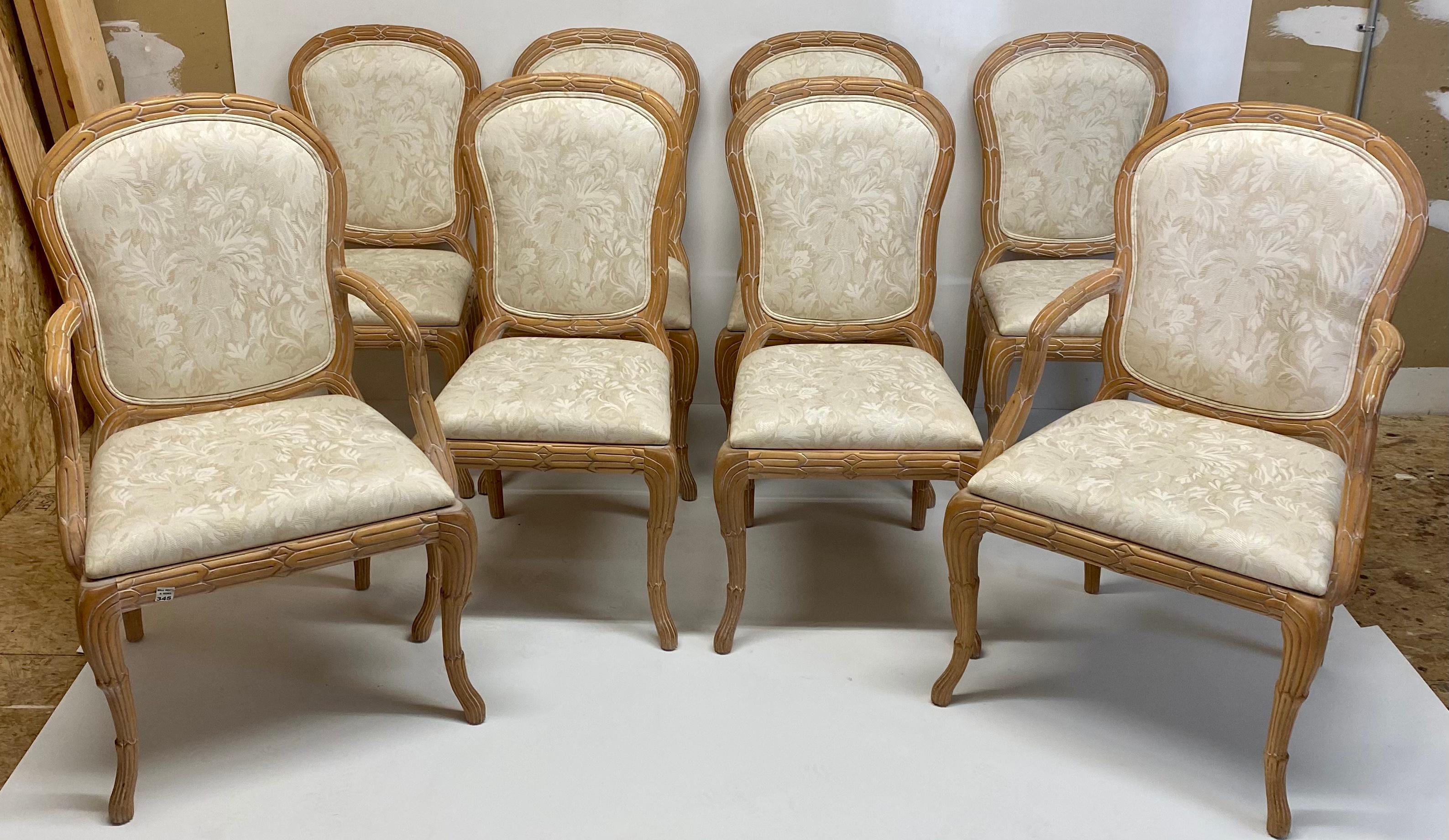 This is a set of eight carved faux bois dining chairs by New York manufacturer Casa Stradivari. The frames are pine, and the vintage tonal leaf upholstery is in like-new condition. They are marked. Sides; 19.75” L x 21” W x 38.5” H.