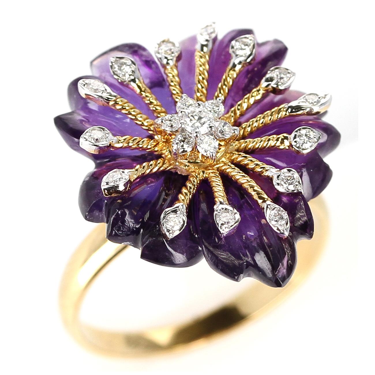  A stunning and intricate-work floral-style carved Amethyst with gold work and diamonds in a ring. Diamond Weight: 0.22 cts, Amethyst: 11.76 cts. 14K Yellow Gold. Matching Earrings available. Ring Size 8.  Metal type and stones can be customized. 