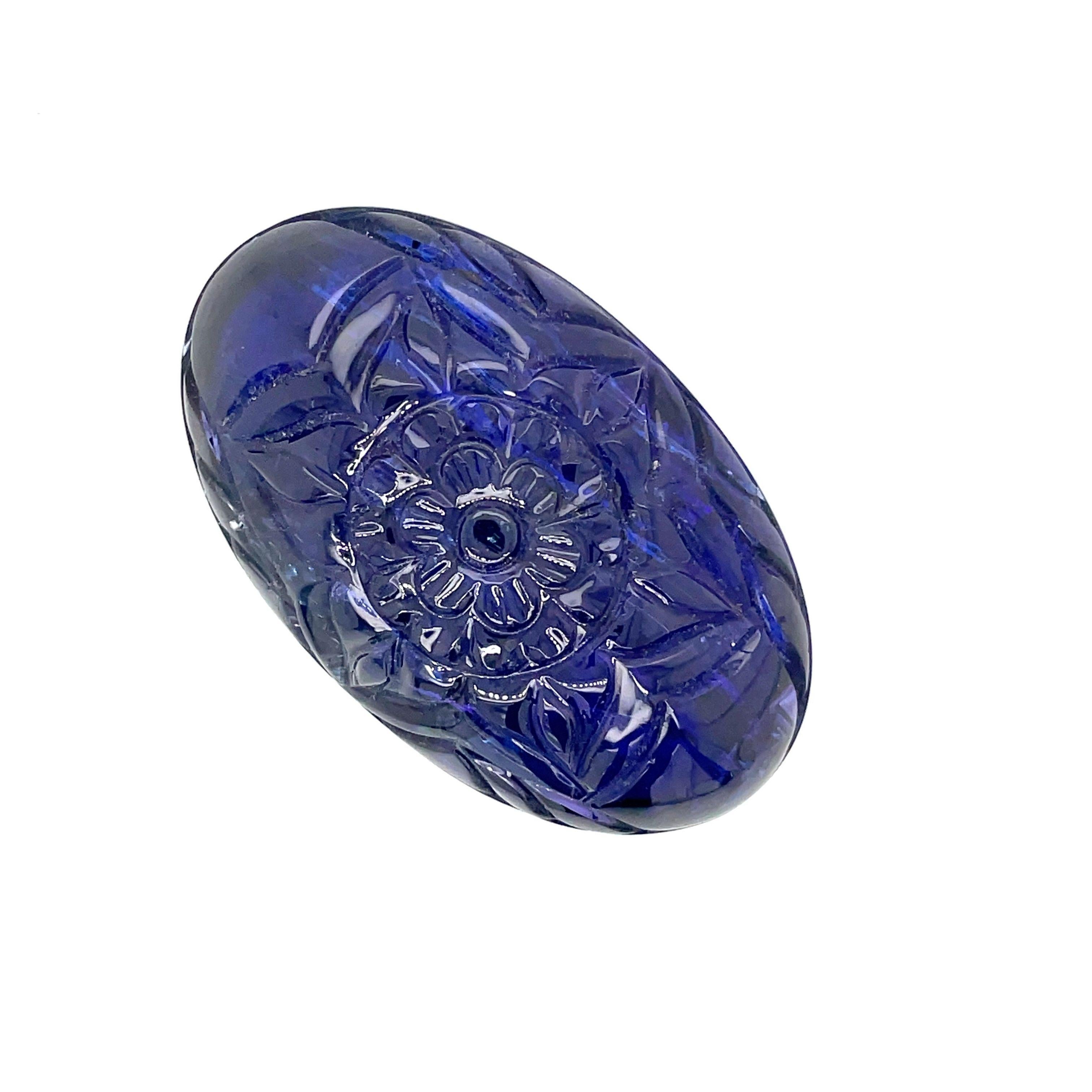 Take a look at our Carved Flower Oval Tanzanite, weighing 178.33 cts. and embrace the spirit of blossoming beauty. 

This stunning piece of art is crafted to mirror the vibrant beauty of nature.

The lovely flower arrangement on this stone evokes