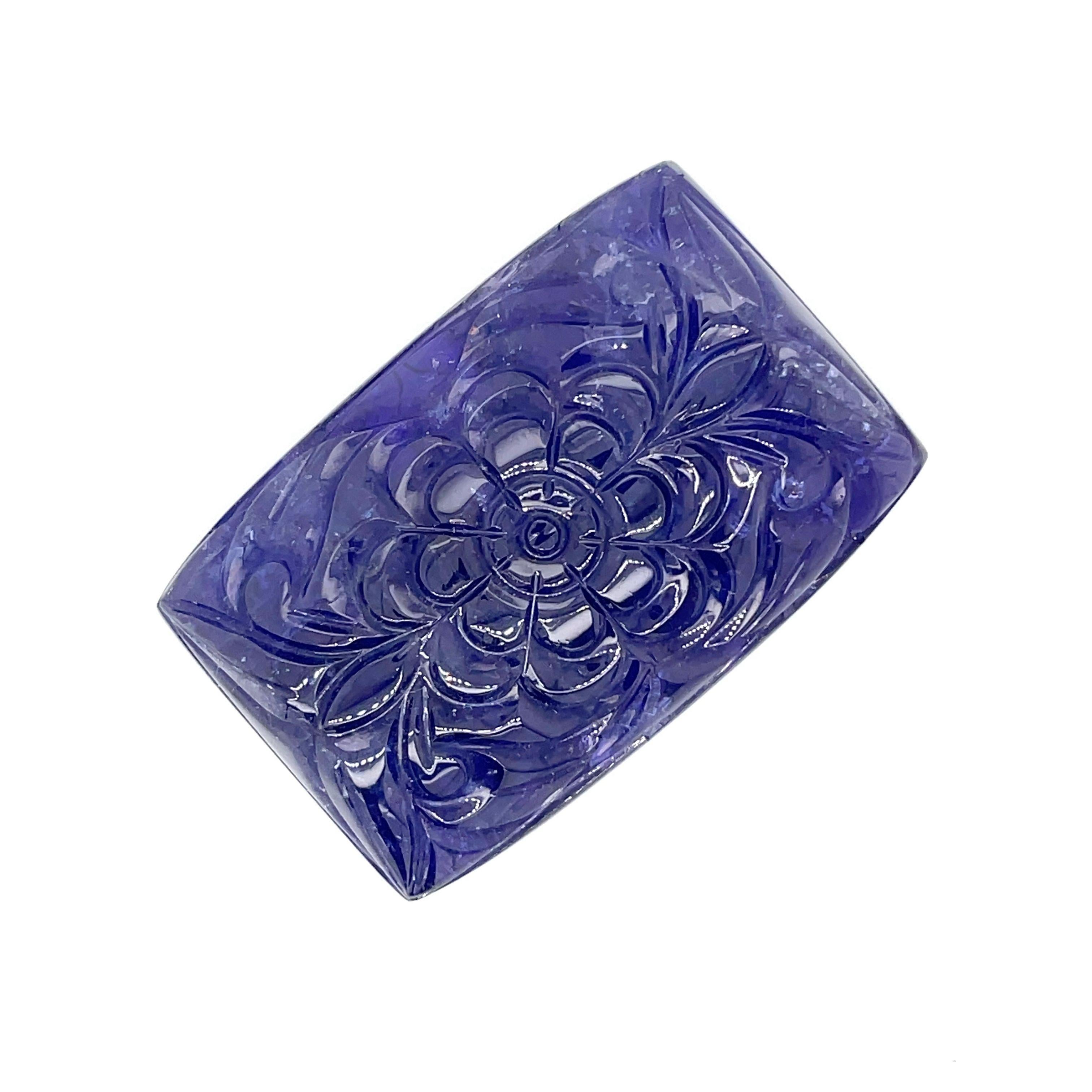 With a weight of 176.08 carats, this stunning Carved Flower Rectangular Tanzanite will add a stunning touch of nature's magnificence to your jewelry collection.

Adorned with intricate floral designs that evoke feelings of timeless romance and