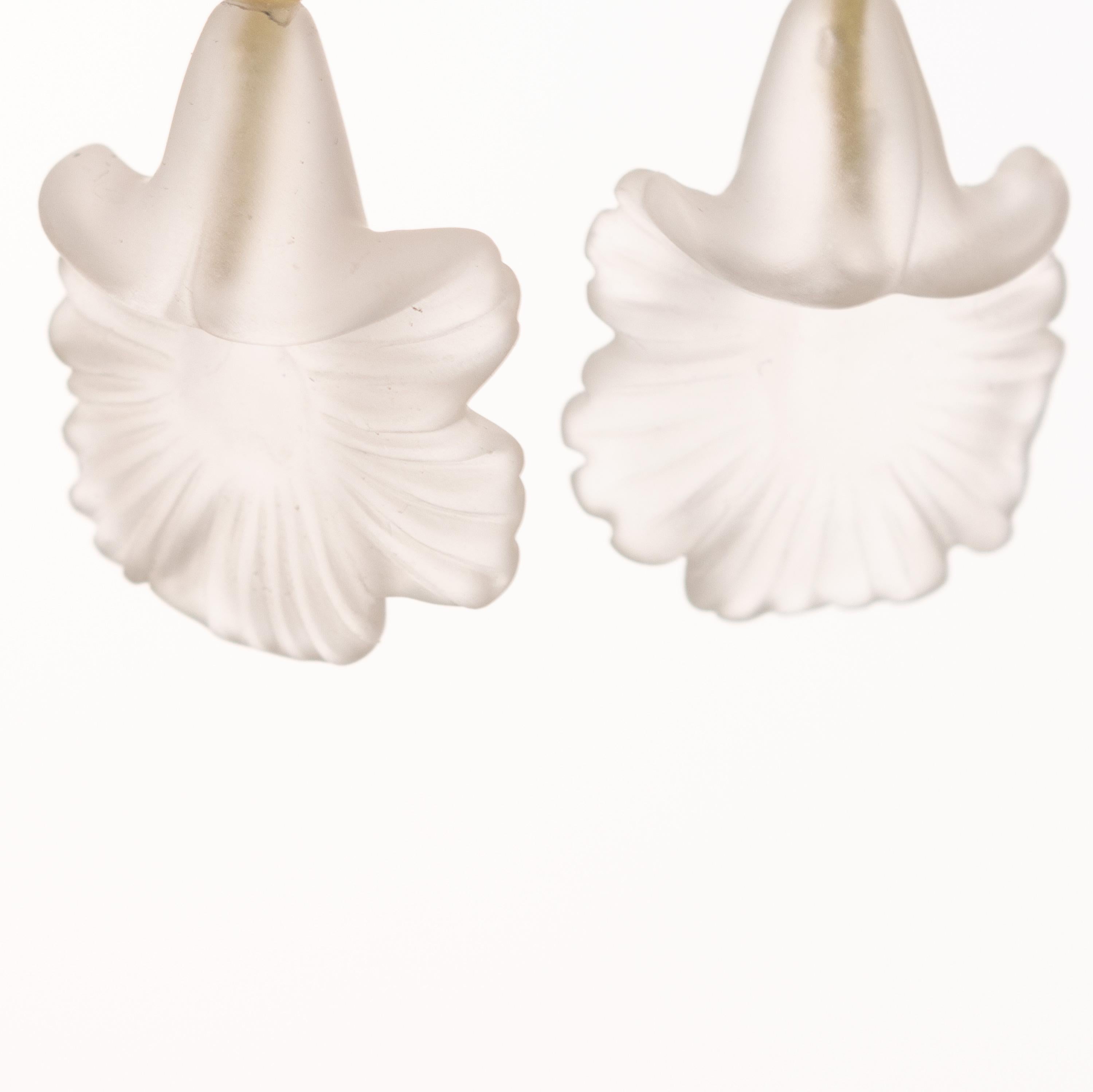 Stunning unique pieces. Rock crystal flower shaped earrings. Marvelous jewel with 18 karat yellow gold setting.

Rock crystal brings the gentle healing power of the sea. It is a stress relieving stone; relaxing, soothing and calming to the emotions.