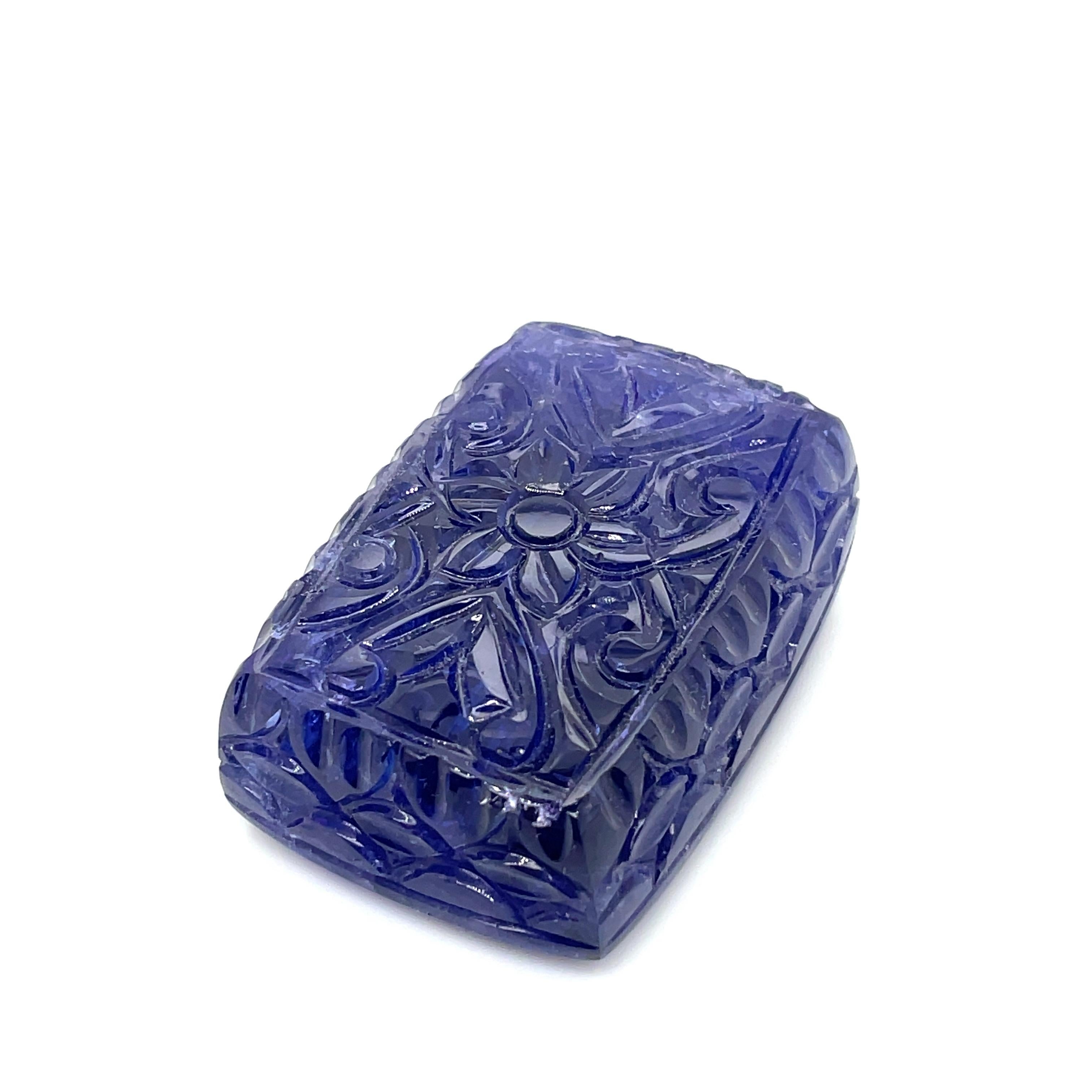 Beautifully carved with delicate floral patterns that evoke the essence of a full blossoming garden, this tanzanite masterpiece has a remarkable weight of 229.17 carats.

The flower pattern captures the essence of nature's seductive charm.

Any