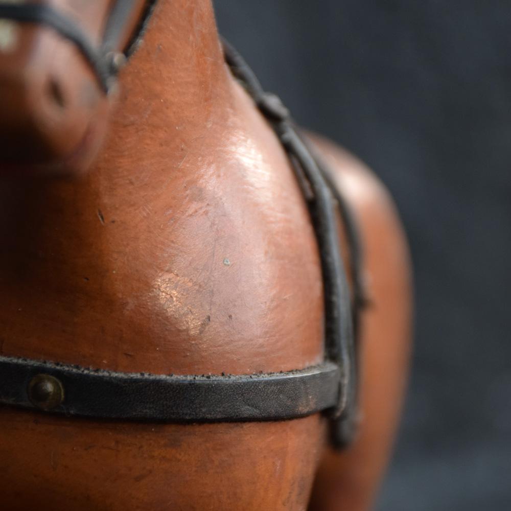 An unusual form of a late 19th century carved wooden Folk-Art horse. Wonderfully detailed with original paint, leather tac and ears. This figure also has real horsehair attached as its tail. Lovely tactile form with lots of character. Although