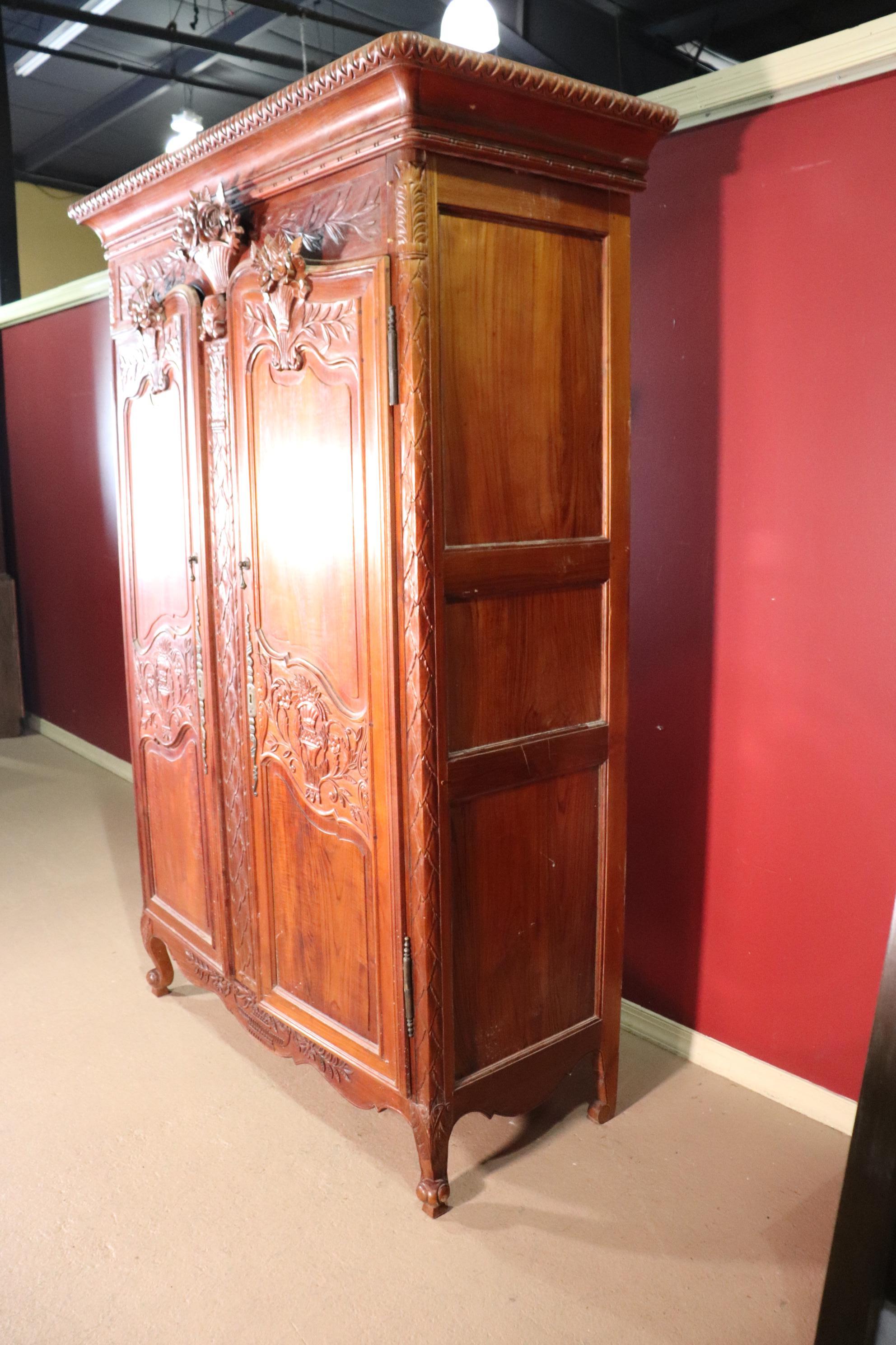 Late 20th Century Carved French Country Louis XV Solid Teak Armoire Wardrobe