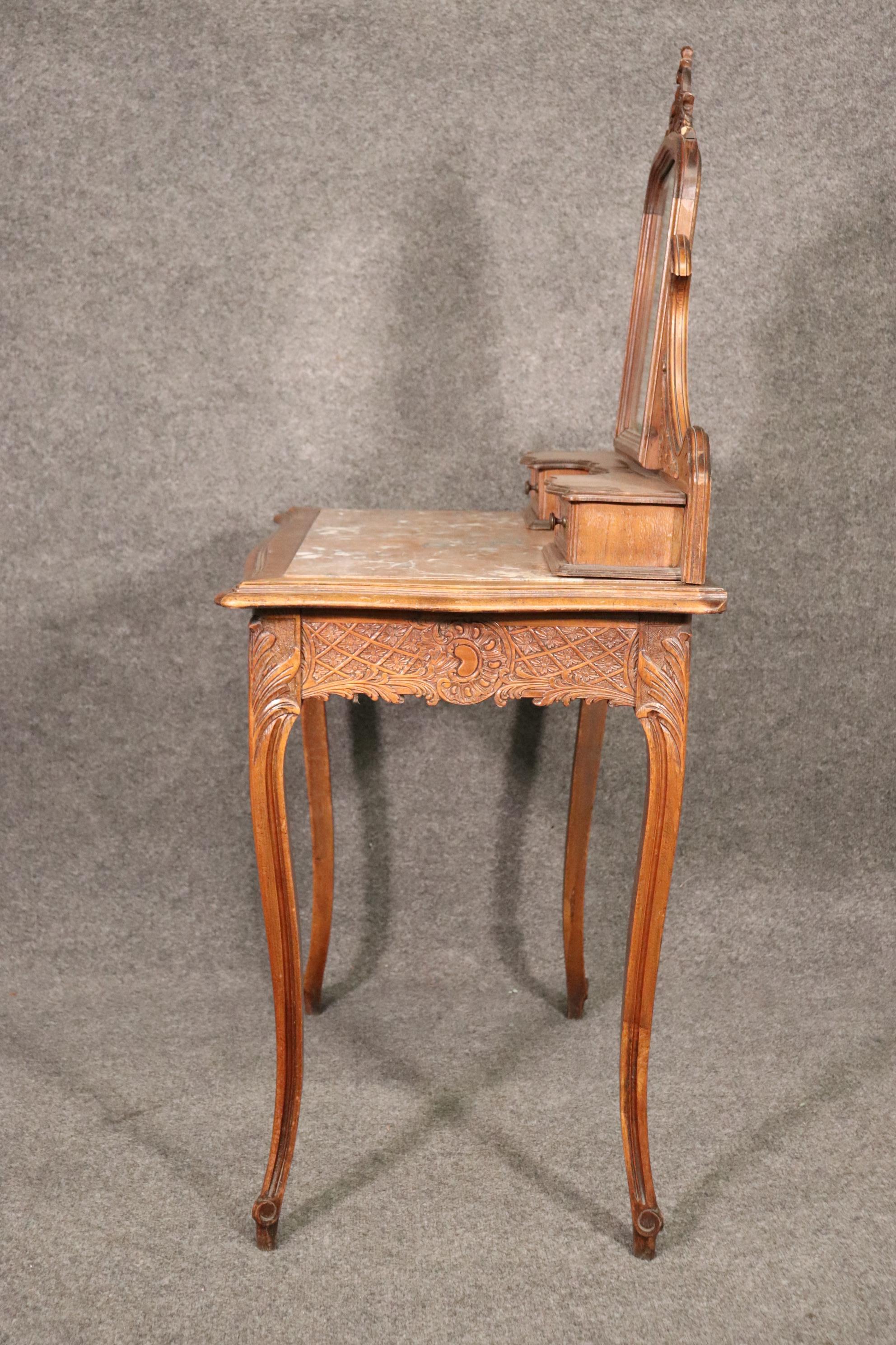 Late 19th Century Carved French Hairpin Top Louis XV Walnut Marble Top Ladies Vanity Circa 1890s