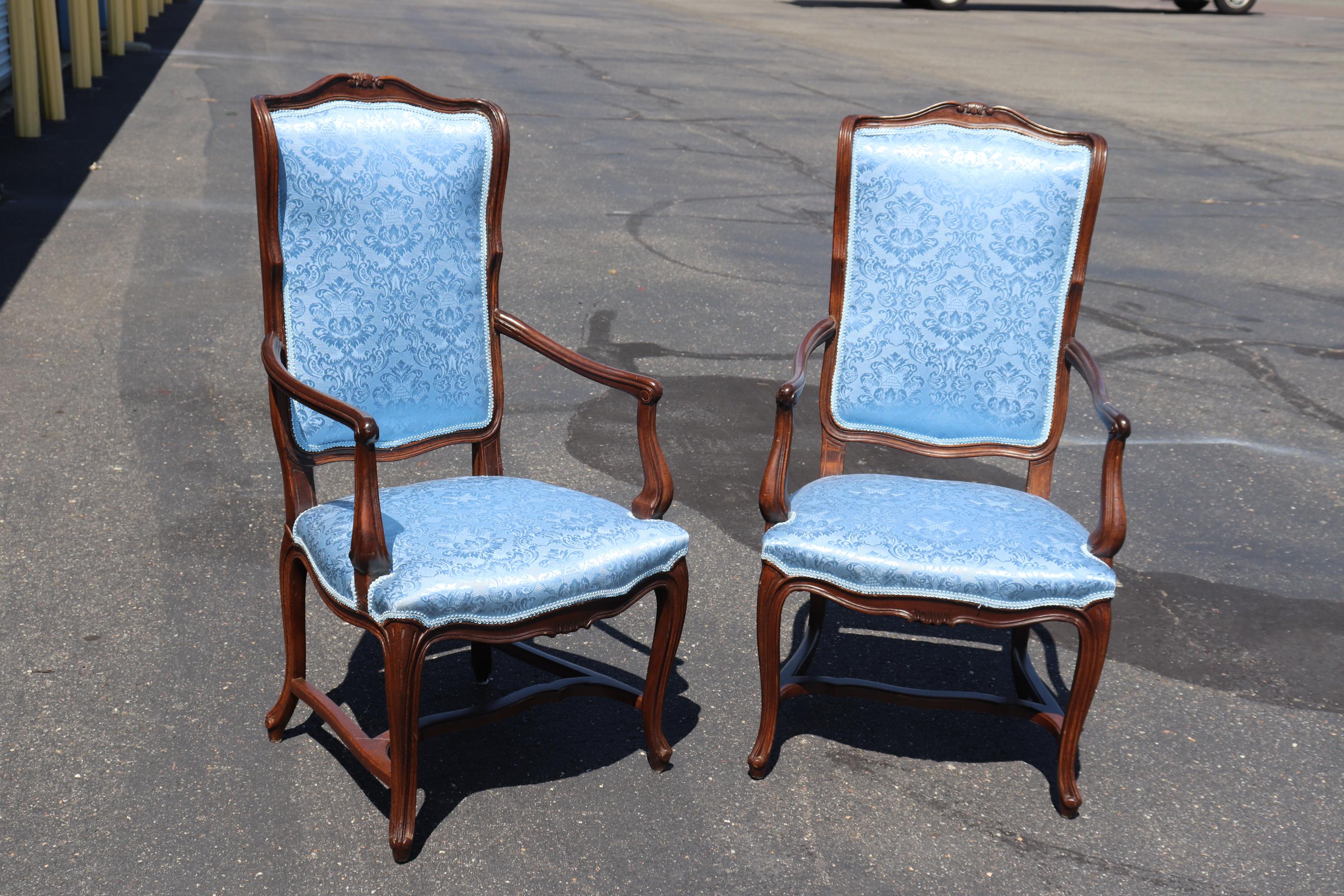This is a beautifully upholstered pair of chairs that are perfect for the head of a dining table or in a living room as accent chairs. The chairs measure 45 tall x 26 deep x 23 wide x 18 inch seat height.