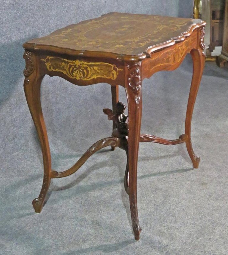 Late 19th Century Carved French Louis XV Puttu Cherub Inlaid Center Hall Table Attr. RJ Horner For Sale