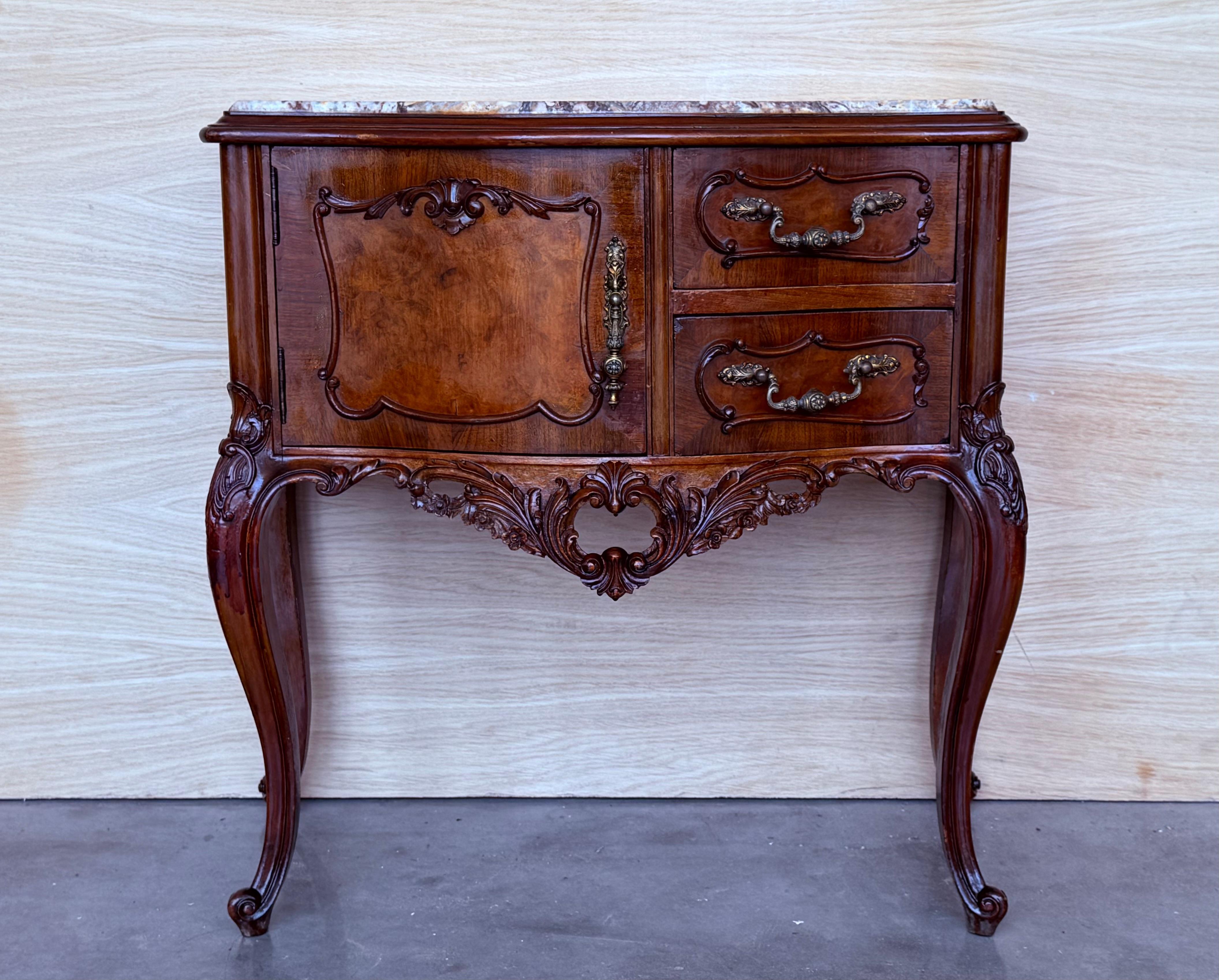 side cabinets from the circa 1930s could be used to flank a sofa or as nightstands. Each has a storage compartment with a hinged door. Opening the door we find a compartment with the original ceramic. 
