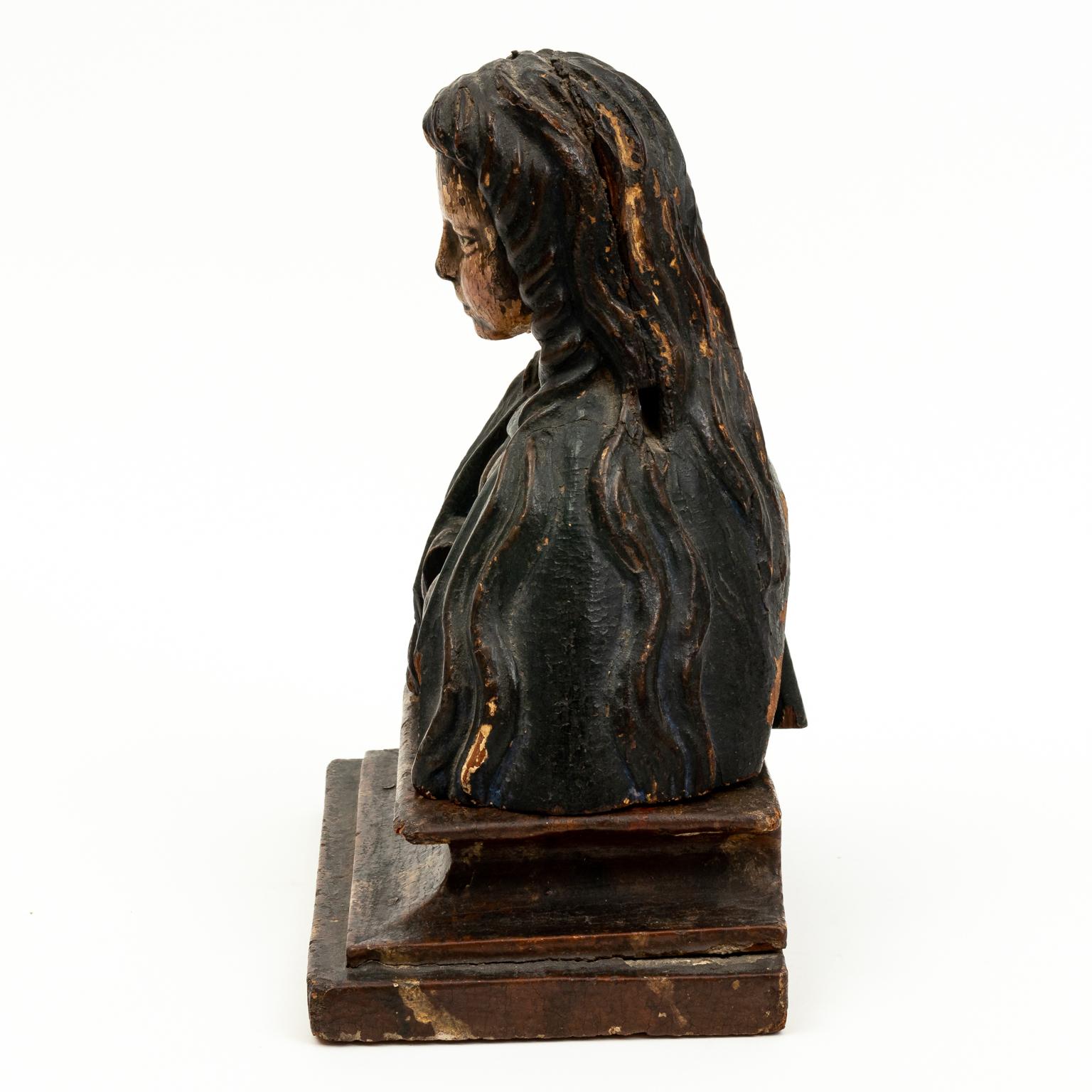Circa 17th century carved fruitwood and polychrome female reliquary on period faux marble box with hole in heart for holding relics. Made in Northern Europe.