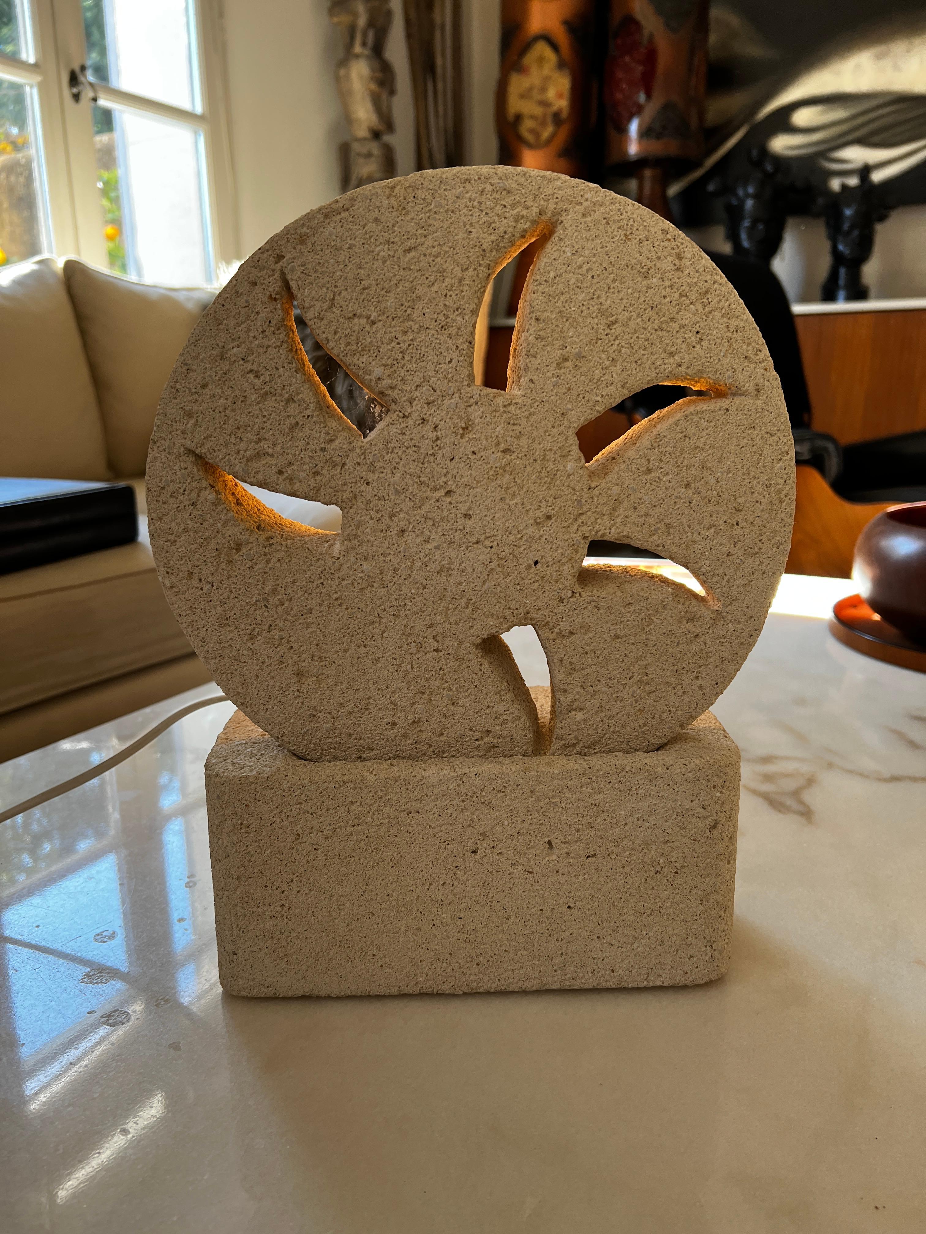 Lamp in stone of Gard carved 1970 in the taste of Albert Tormos in the shape of openwork wheel.