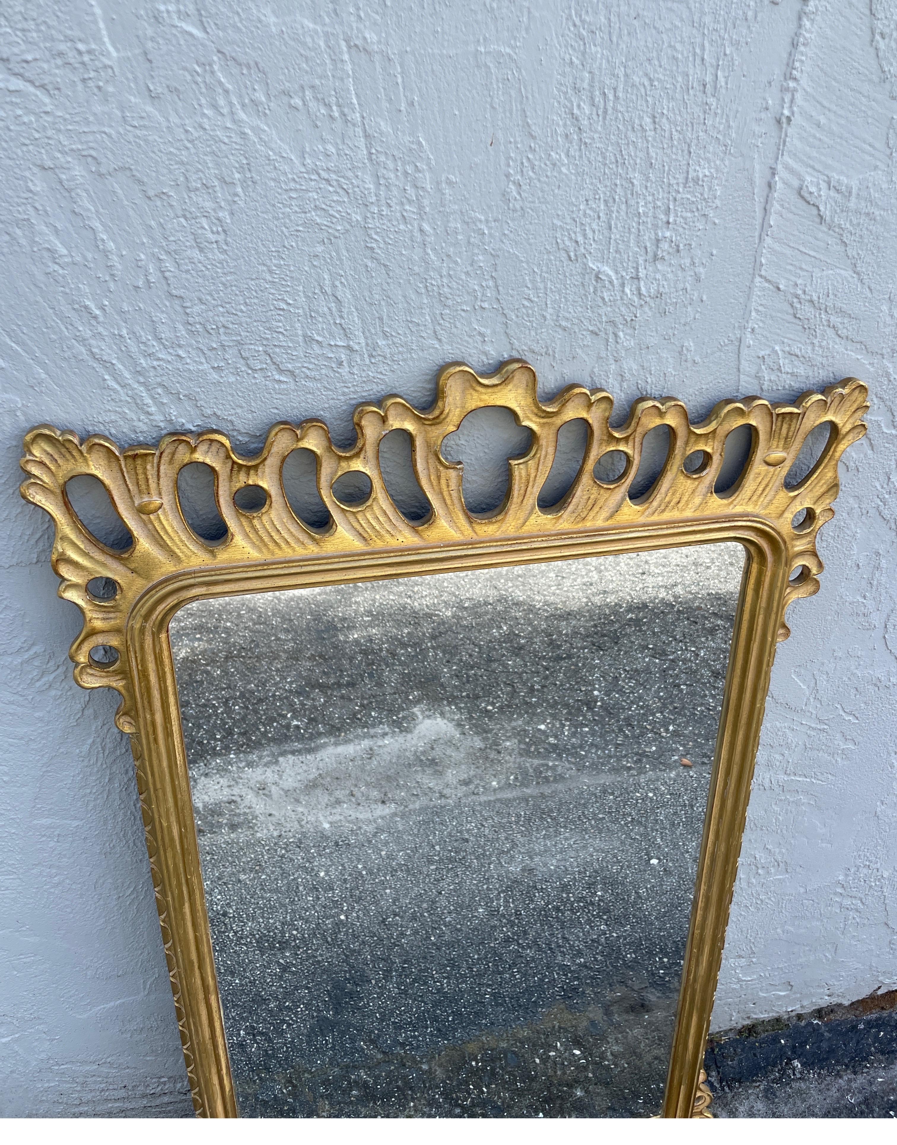 Vintage Italian Pierced Giltwood wall mirror. A very unique and airy design that will enhance any space.