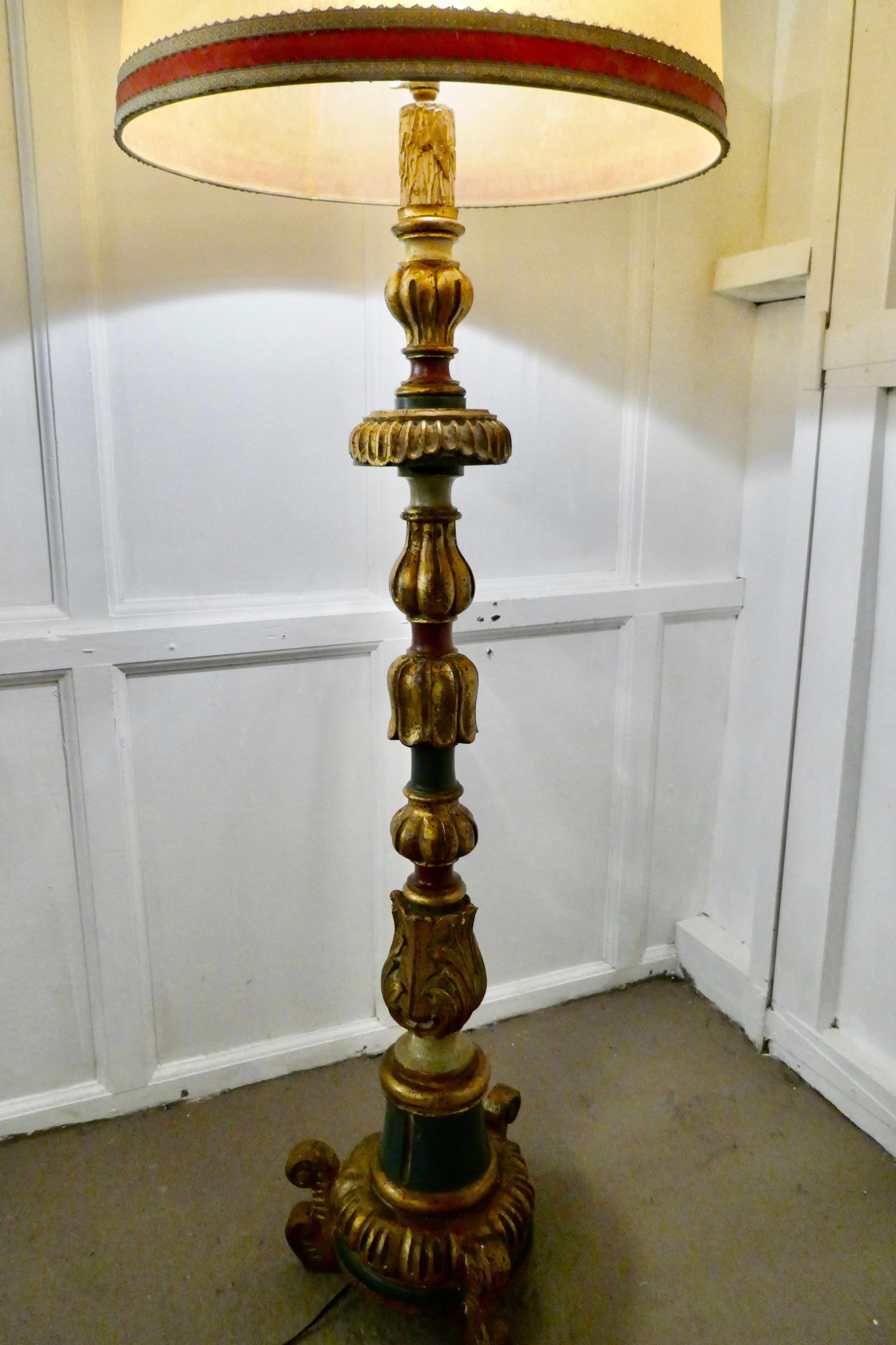 Carved gilt and painted Baroque floor lamp

This is a very decorative piece, with its original matching vellum and velvet trimmed Lamp Shade
The lamp is in good original condition with very slight distressing to the painted finish, the wiring has
