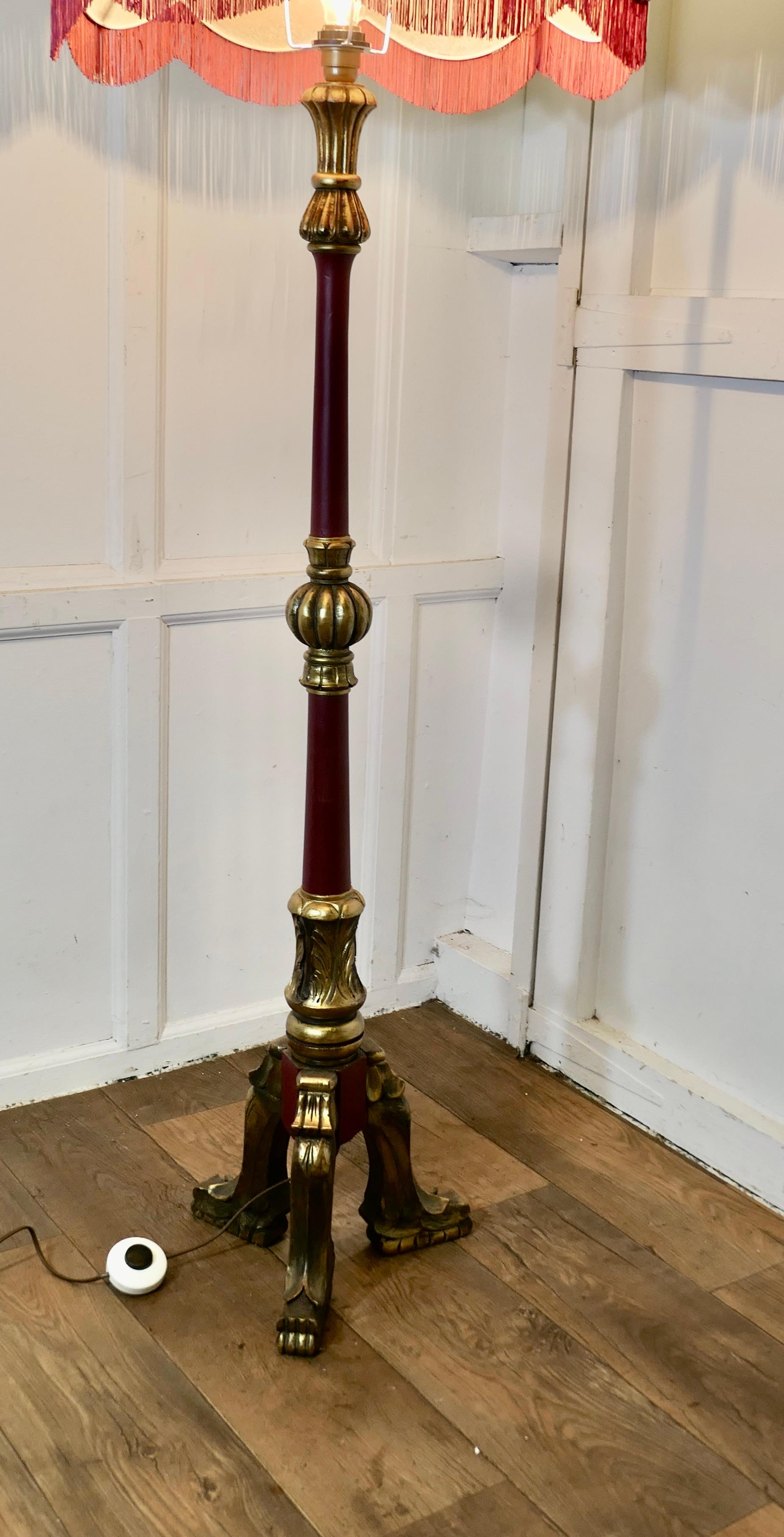 Carved Gilt and Painted Baroque Floor Lamp

This is a very decorative piece, set with a very attractive scalloped and  fringed Lamp Shade
The lamp is in good original condition with very slight distressing to the burgundy and gold painted finish,