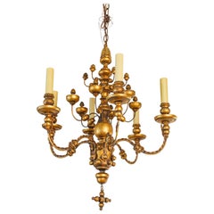 Sculpté et doré  Lustre italien en métal et bois  Design/One.