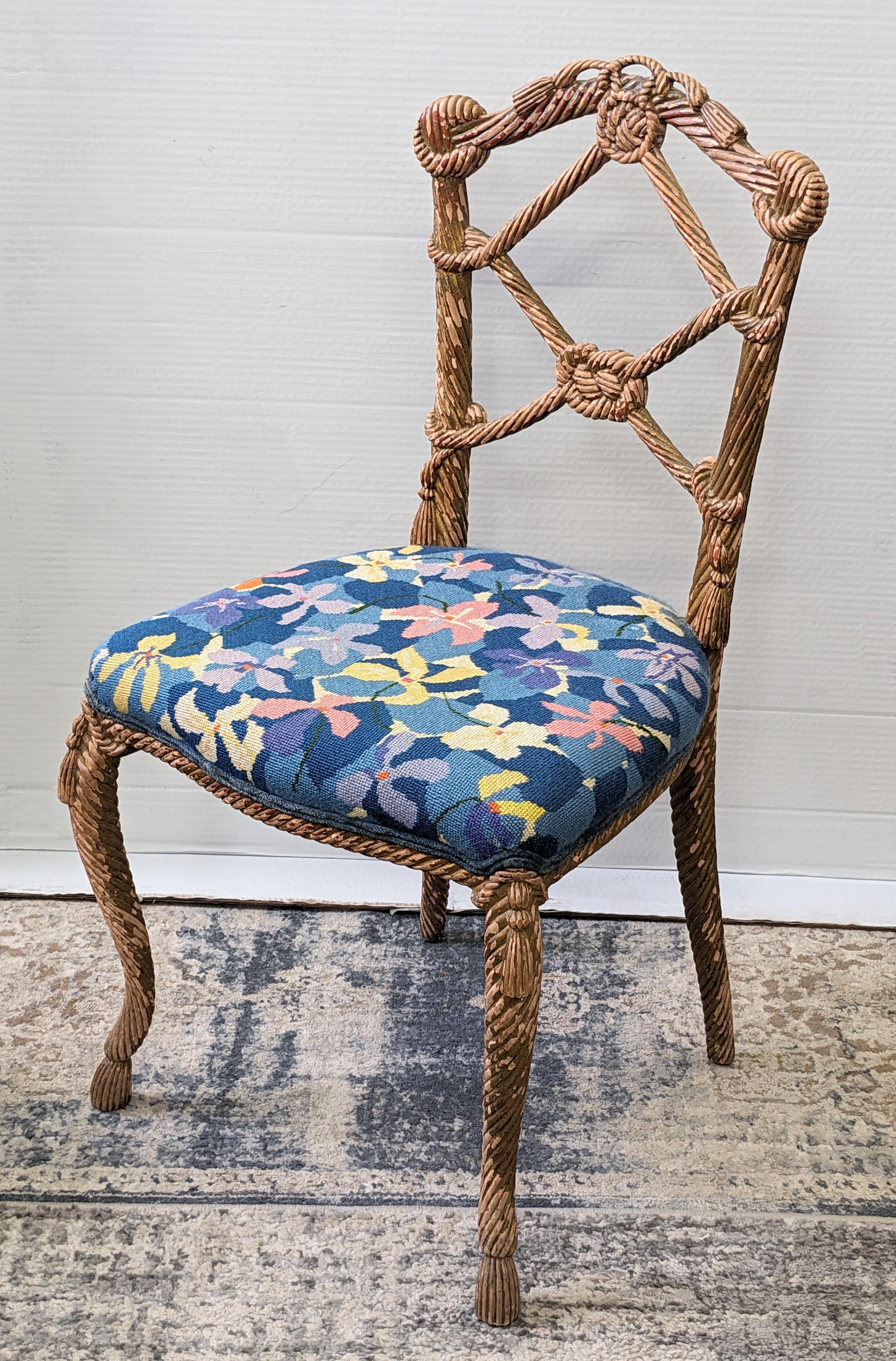 Amazing Carved Wood Gilt Tassel Rope Motif Chair from a Dorothy Draper designed estate from Westchester County, NY. Antique gilt accent chair reimagined in the period with a vibrant floral needlepoint seat. Seat 17