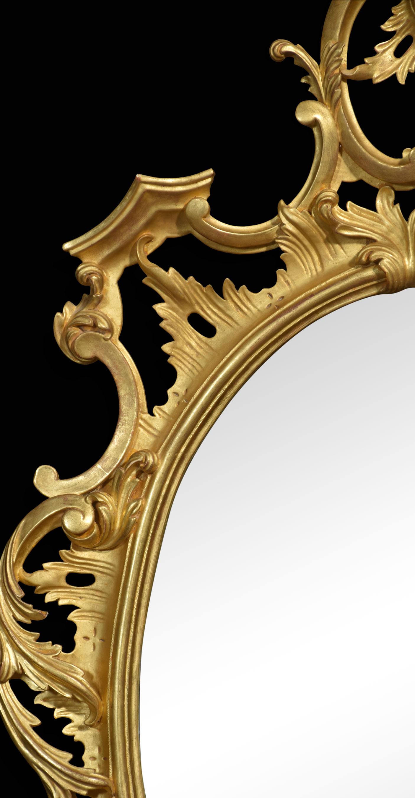 Georgian-style Gilt-wood wall mirror, the well-carved frame decorated with foliated and scrolling detail surrounding the original oval mirror plate.
Dimensions
Height 63.5 Inches
Width 35.5 Inches
Depth 3 Inches