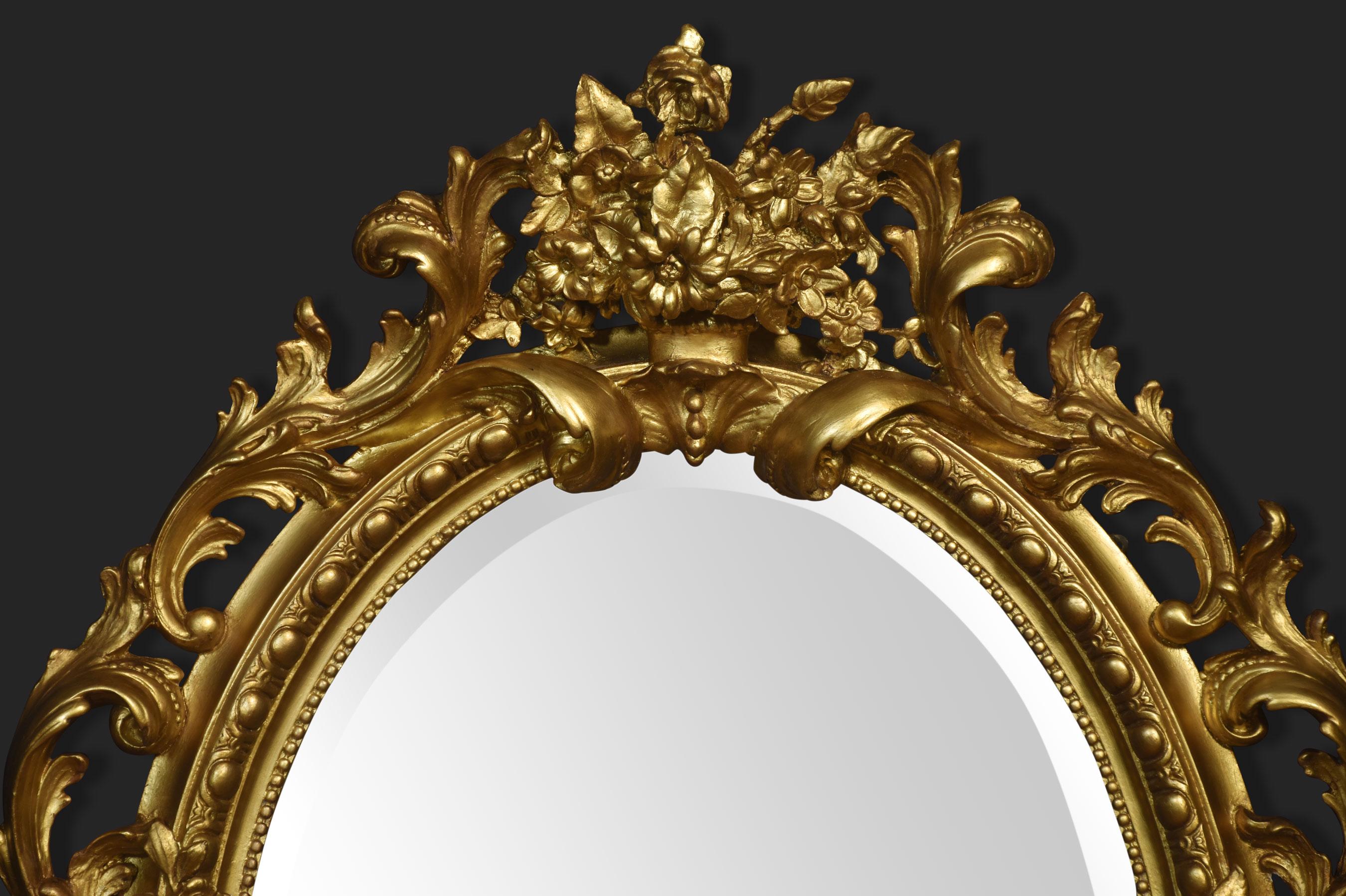 Very large early 19th-century wall mirror, the well-carved frame decorated with foliated and scrolling detail surrounding the original oval beveled mirror plate.
Dimensions
Height 51 Inches
Width 42 Inches
Depth 8 Inches