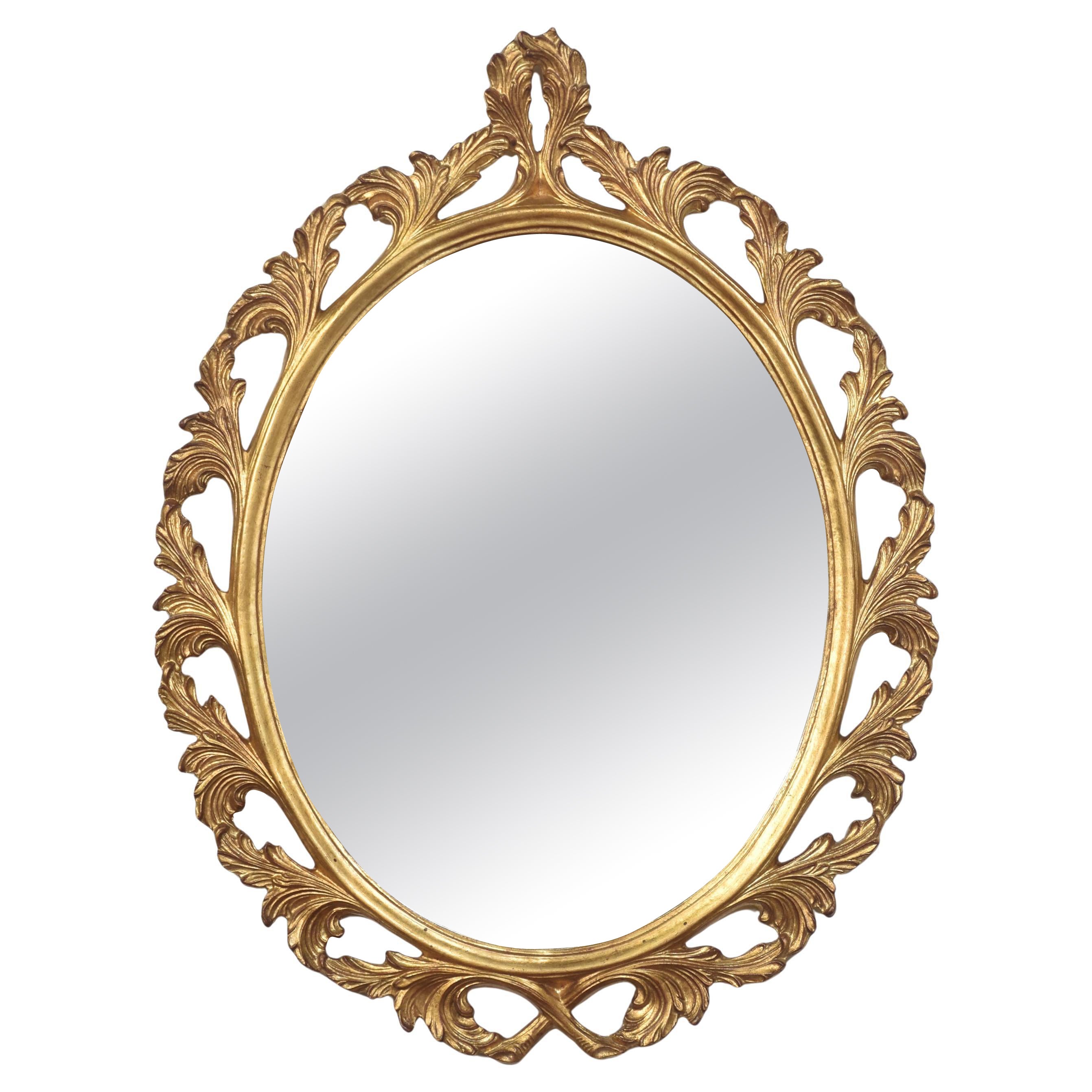 Carved gilt-wood oval wall mirror