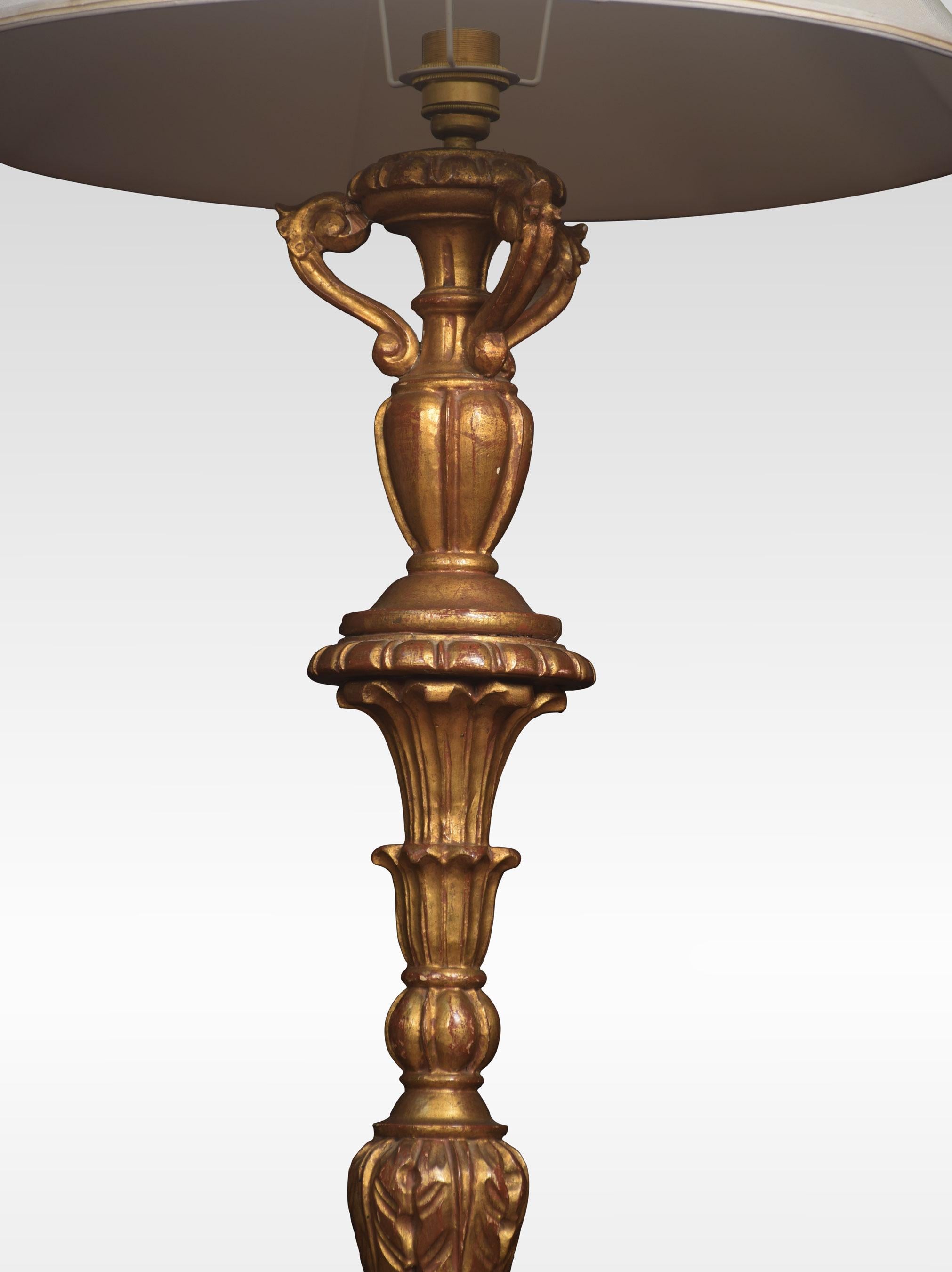 Carved giltwood standard lamp, with a spiral twist stem, raised up on circular base terminating in bun feet.
Dimensions
Height 62 inches
Width 13.5 inches
Depth 13.5 inches.