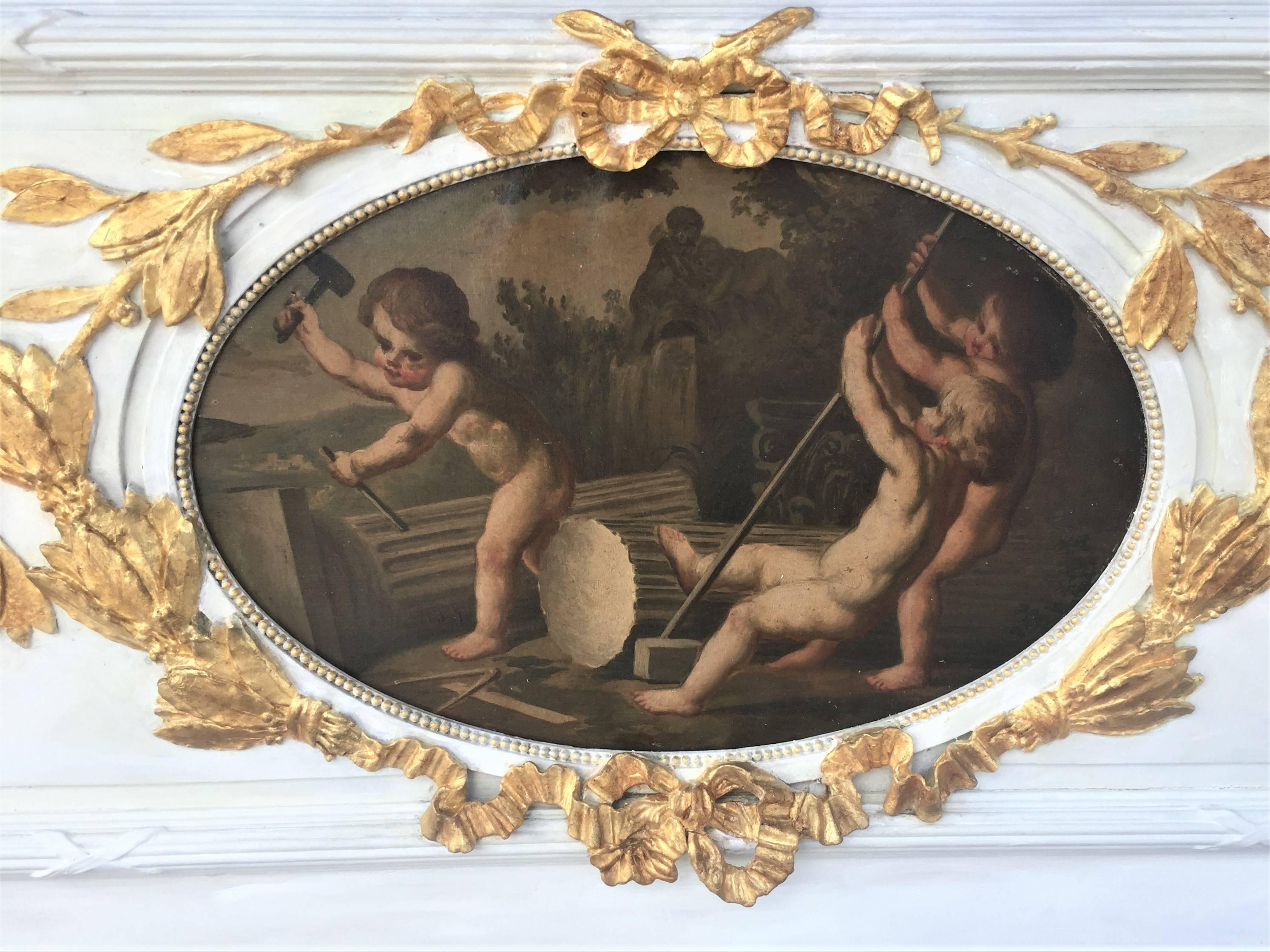 The architectural frieze fragment probably removed from panelling (boiserie). The neoclassical styled panel with leaf garland intertwined with ribbon surrounding a central oil inset of cherubs or putti doing construction with marble columns,