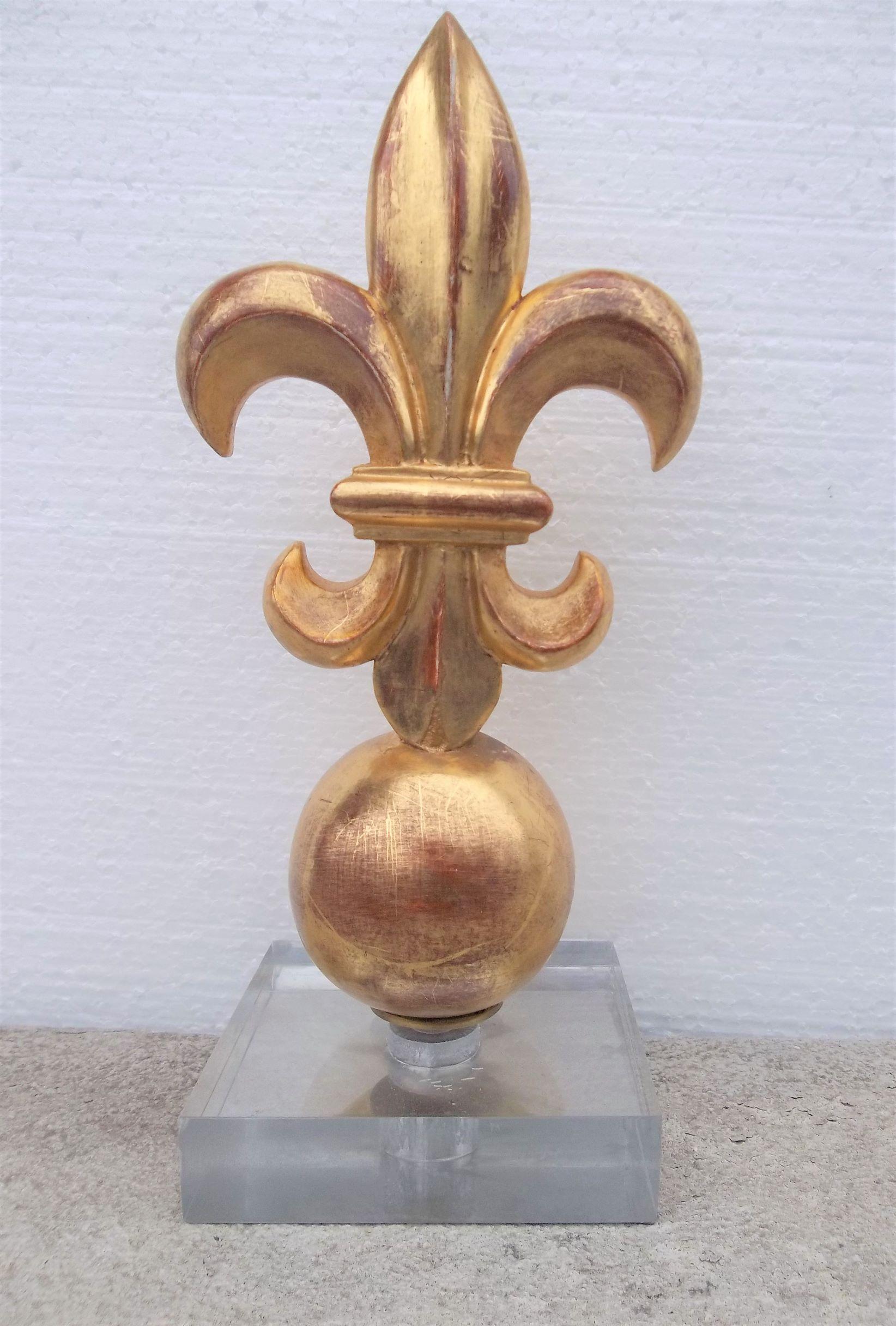 In full relief. Sometimes spelled Fleur-de-lis, this listing is for one of a set of three remaining with differing . This listing is for one loosely mounted (meaning can be removed ) on a modernistic acrylic display base or stand . The under side of