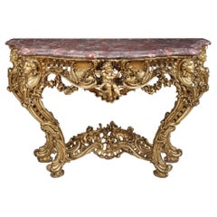 Table console en bois doré sculpté de style Louis XV à la manière de Nicolas Pineau