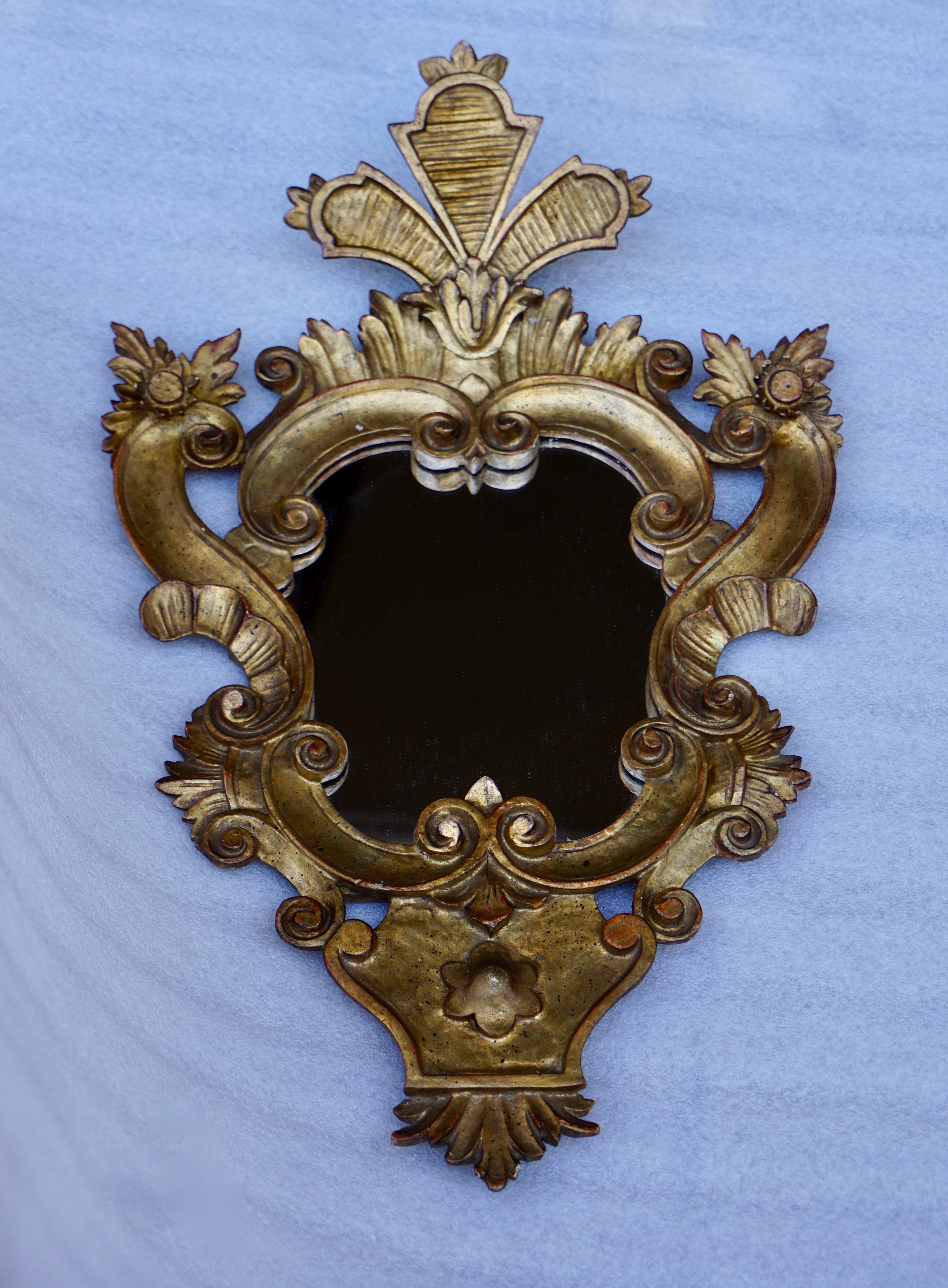Beautiful Large Venetian Rococo style carved gilt wood mirror.
Measures: Height 60 cm.
Width 38 cm.
Depth 10 cm.