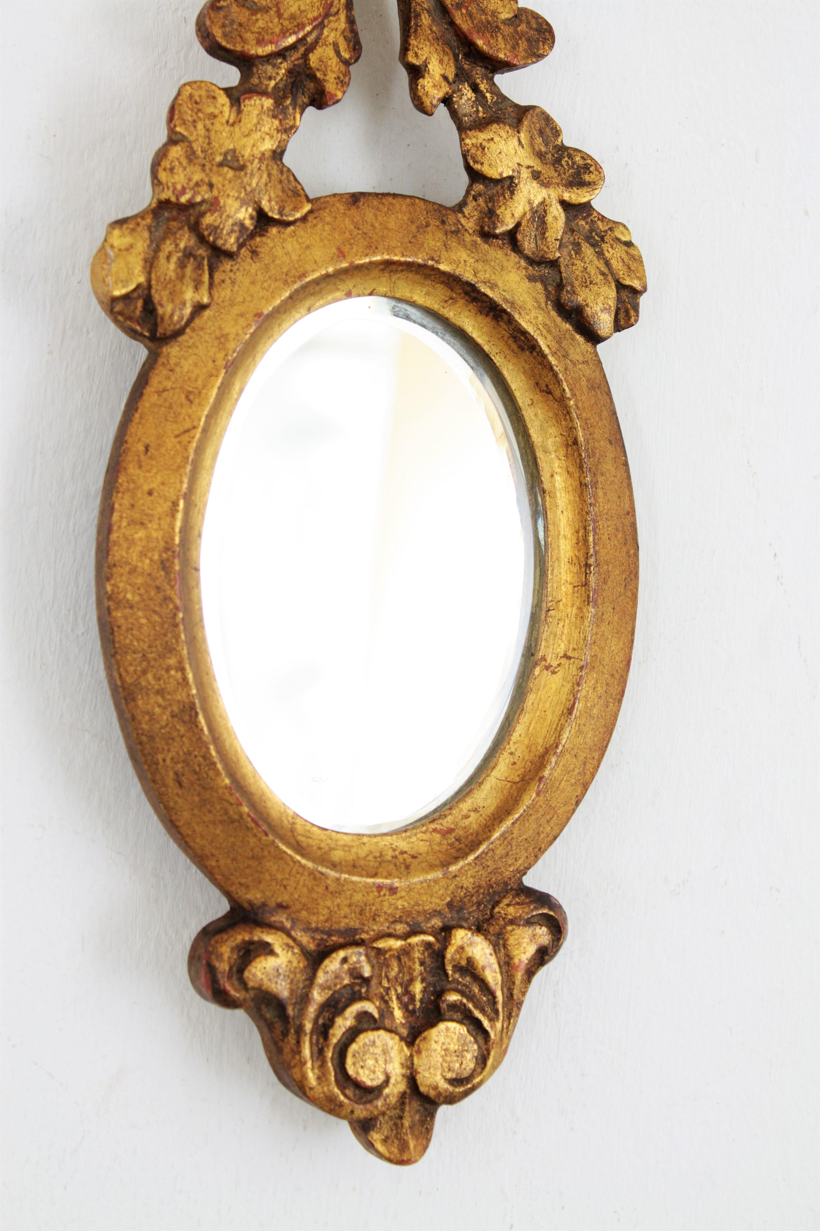 20th Century Carved Giltwood Renaissance Style Mini Sized Mirror with Crest, 1930s