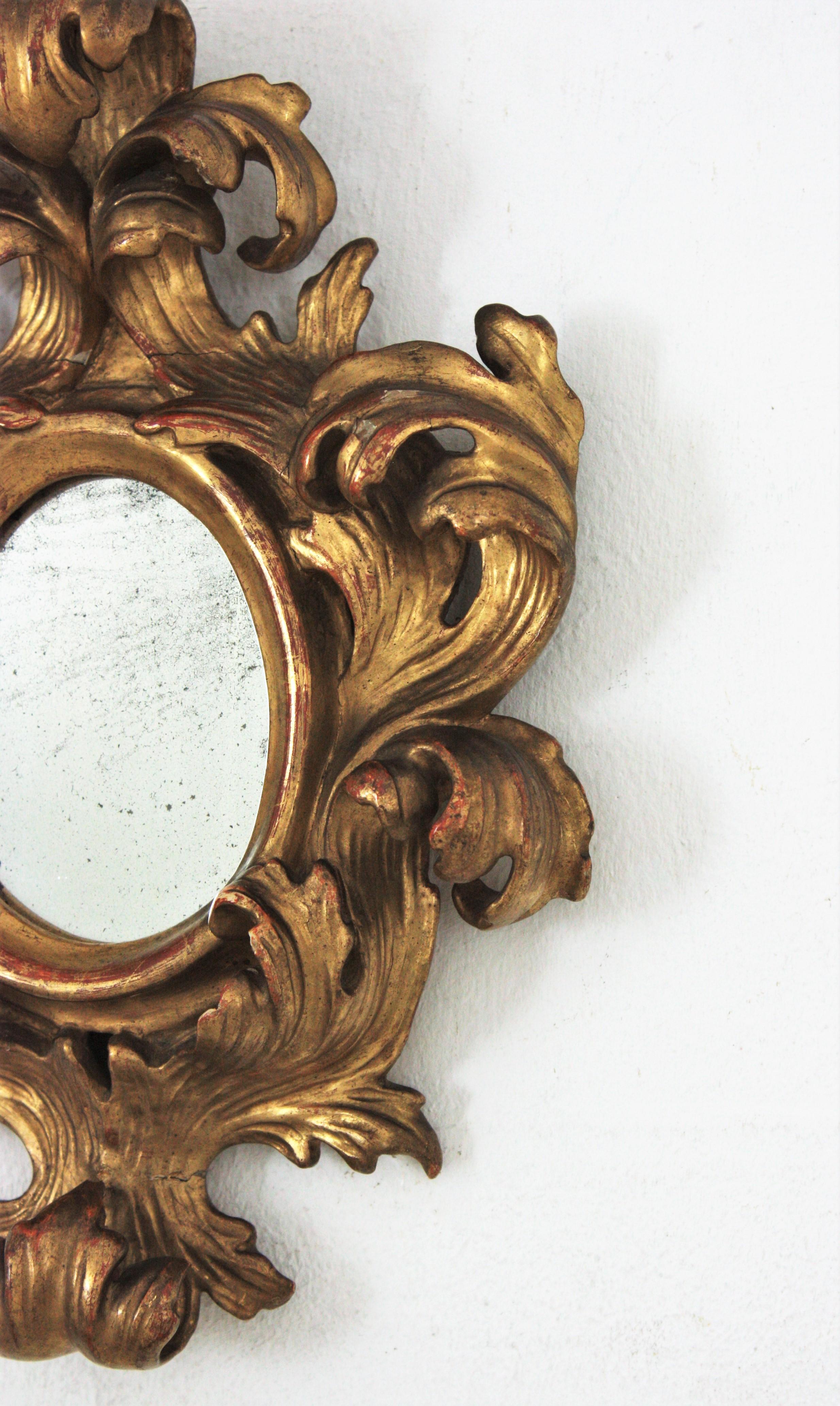 Wood Spanish Rococo Carved Giltwood Mini Sized Mirror with Crest For Sale