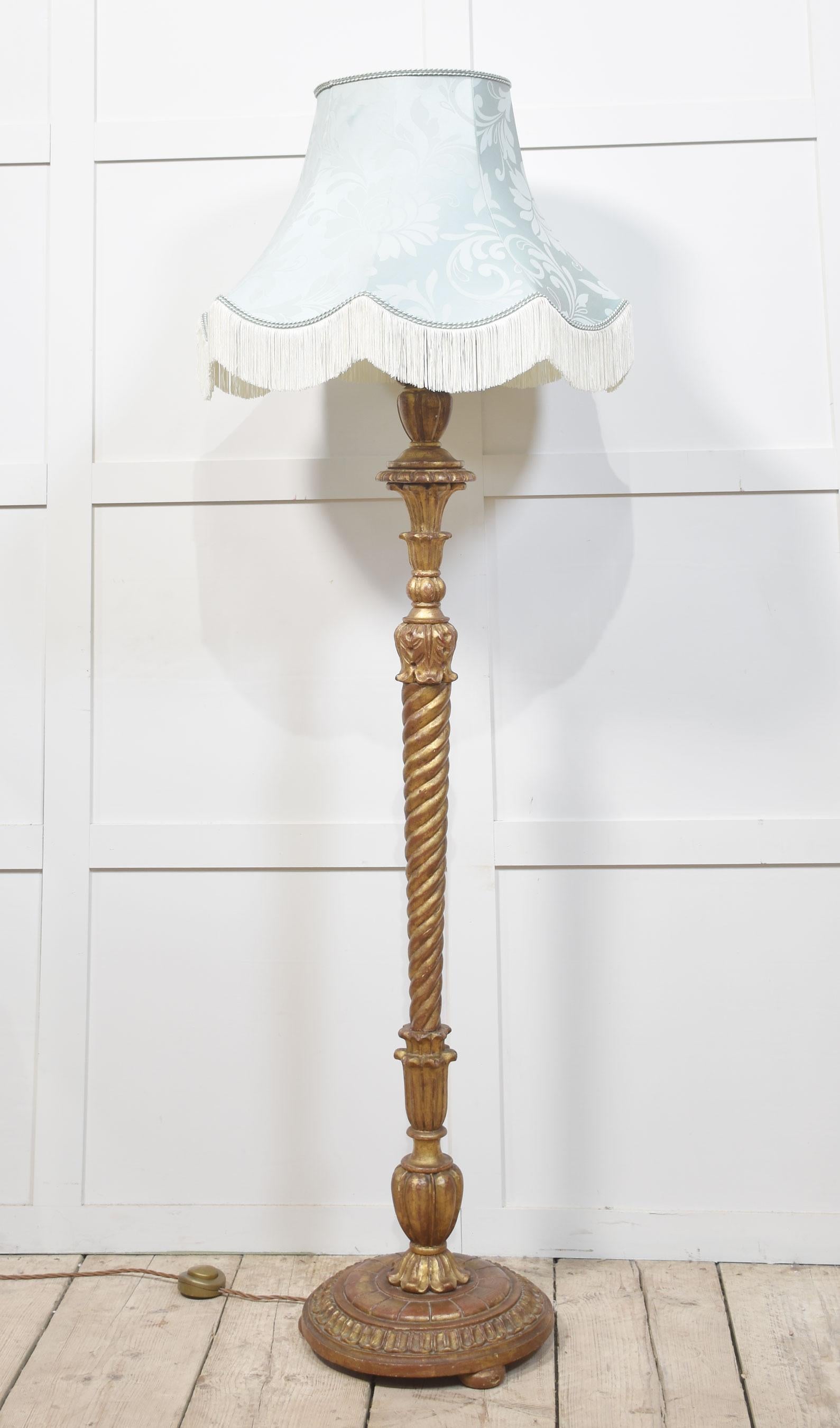 Carved giltwood standard lamp, with a spiral twist stem, raised on a circular base terminating in bun feet.
Dimensions
Height 62 Inches
Width 13.5 Inches
Depth 13.5 Inches