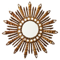 Espejo Sunburst de madera dorada tallada