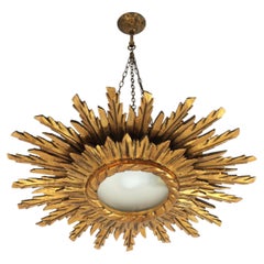 Carved Giltwood Sunburst Pendant Ceiling Light Fixture, Spain ca. 1950s