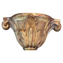 Consolle murale en bois doré sculpté