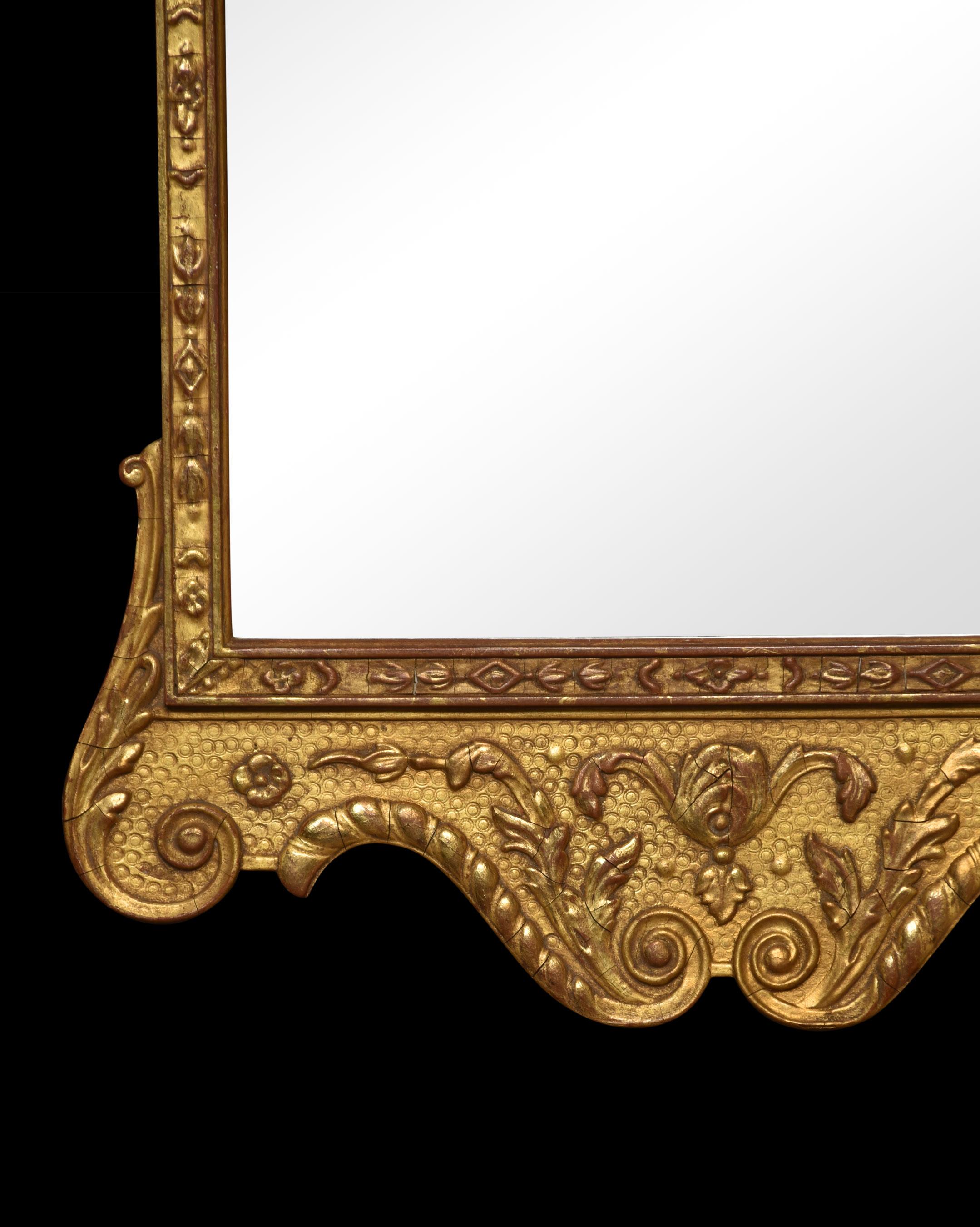 Carved gilt-wood wall mirror, with feathers crest above the original mirror plate surrounded in a gilt-wood frame with leaf and scrolling detail.
Dimensions
Height 32.5 Inches
Width 17.5 Inches
Depth 2 Inches