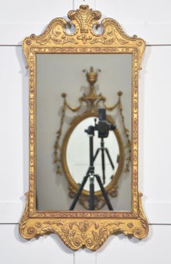 Carved giltwood wall mirror